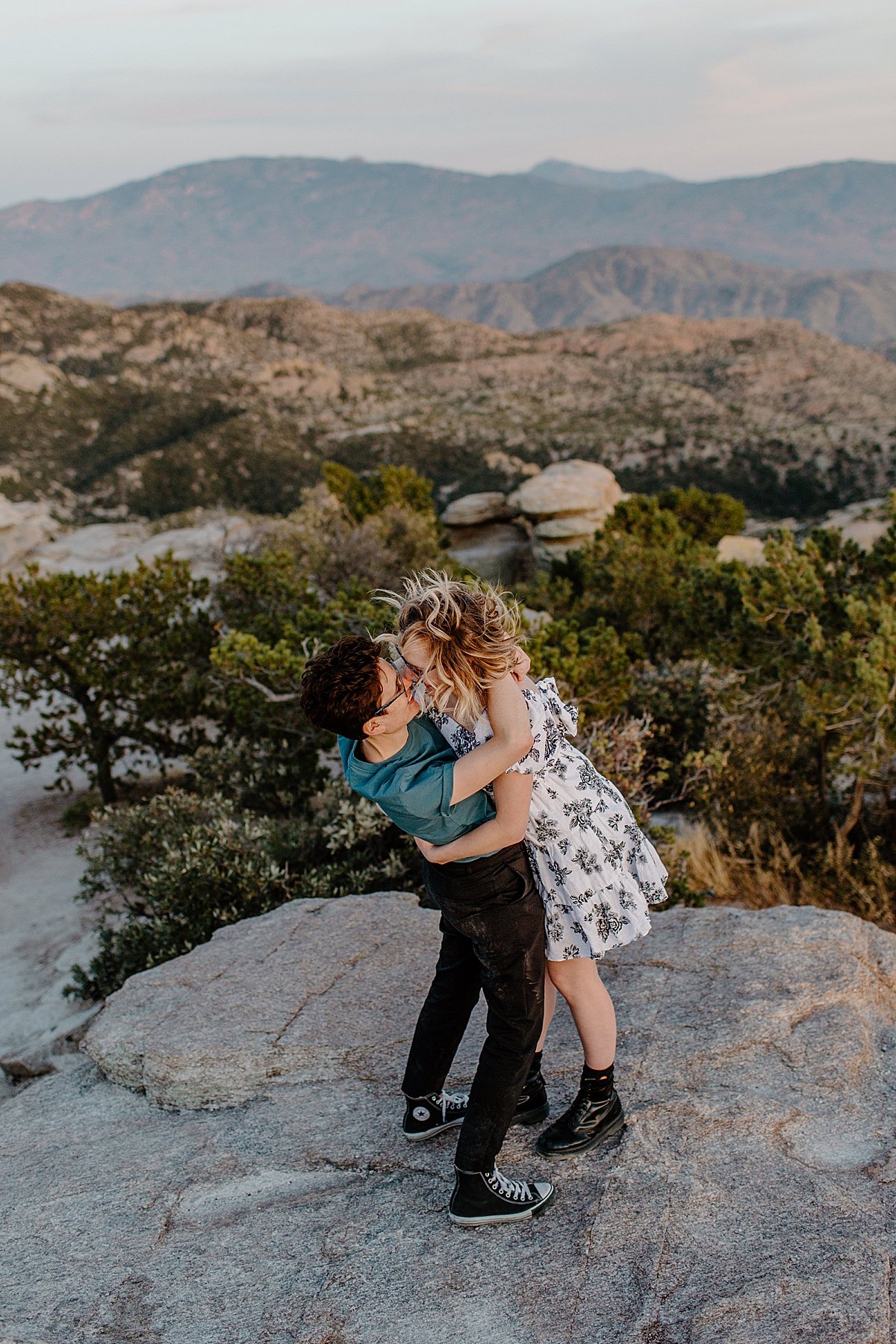  Girl dipping her fiancé on Canyon overlooking Mount Lemmon with Tucson engagement photographer 