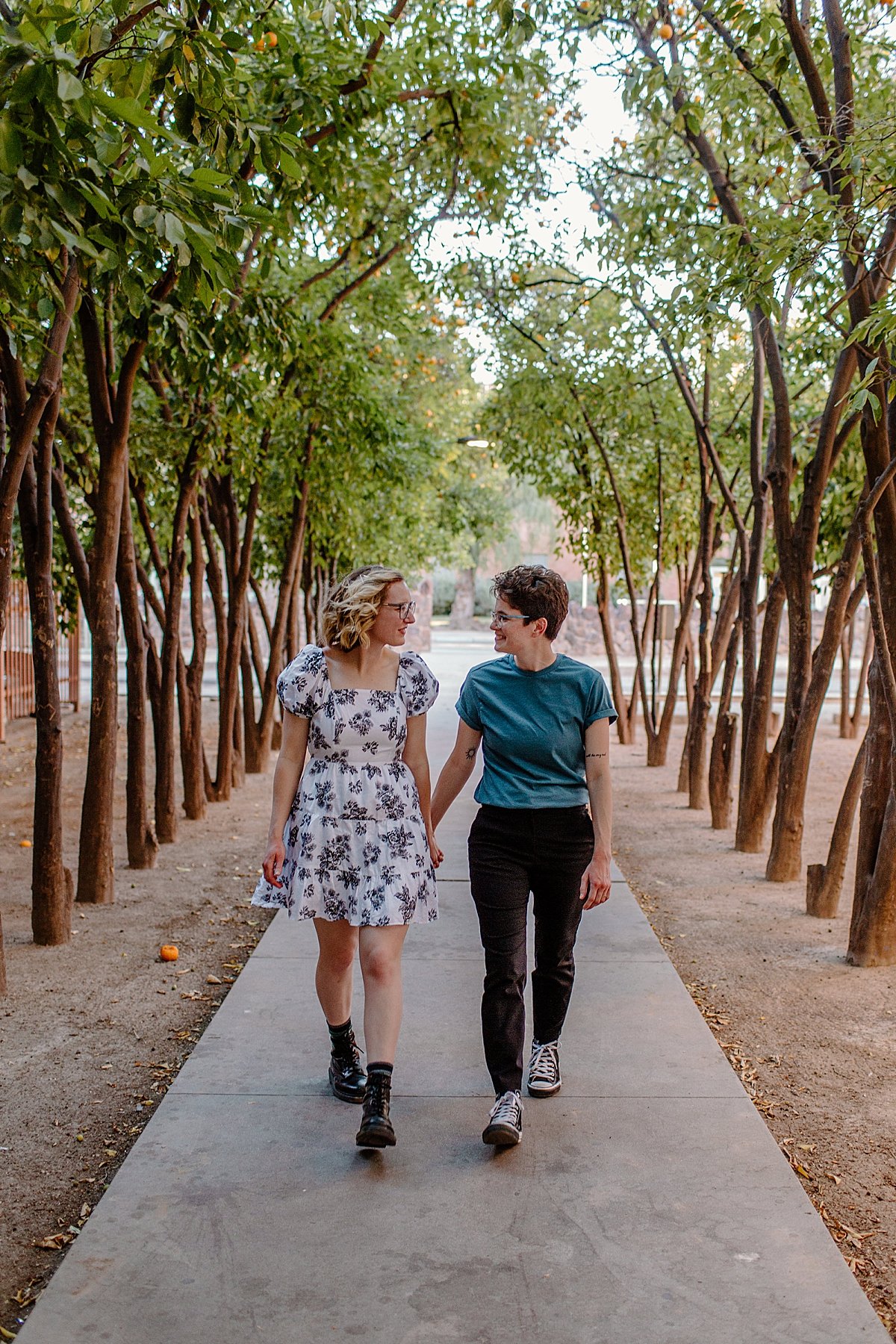 Holding hands and walking campus path in Arizona by Lucy Bouman 