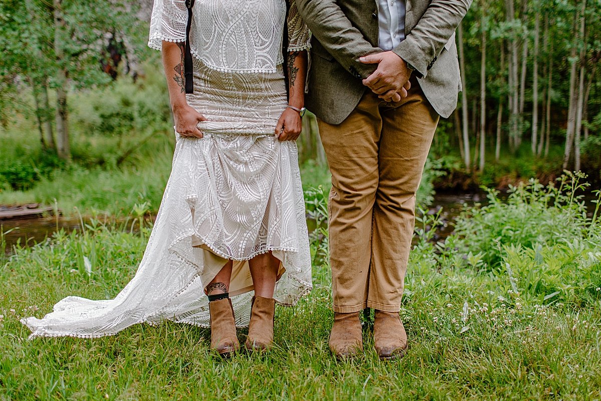  Detailed photo of shoes of bride and groom in the mountains at Greer elopement 