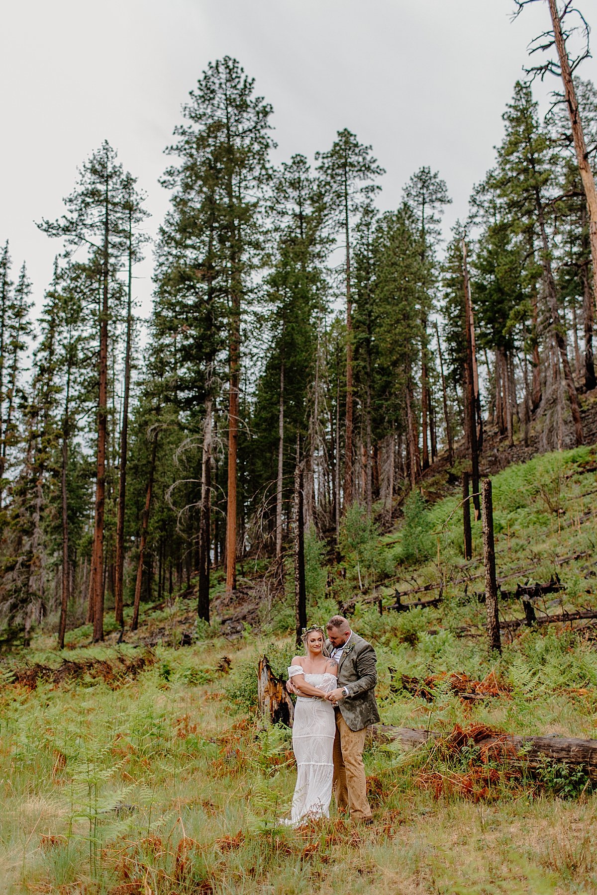  Couple stops at tree location for portraits by Arizona adventure elopement photographer 