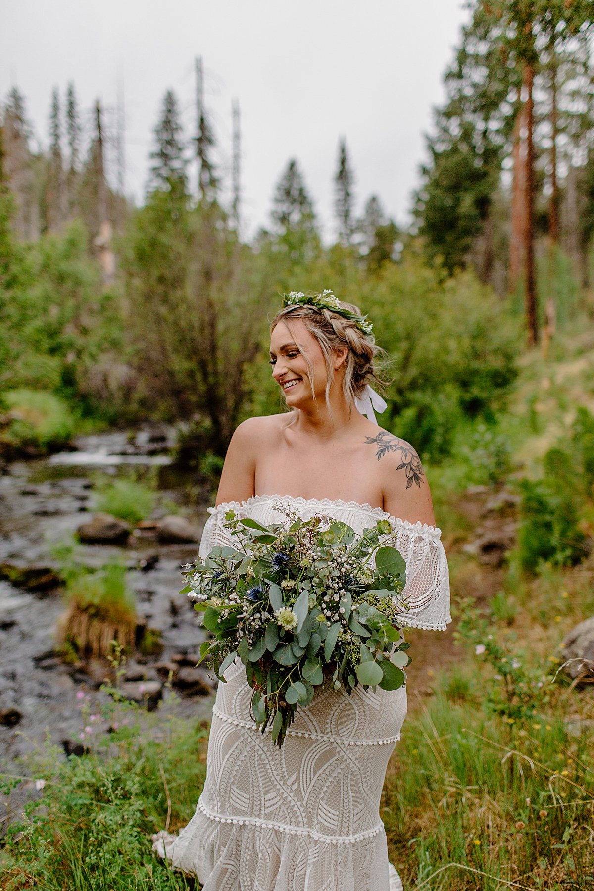  Portrait of Bride holding wedding bouquet and wearing floral headpiece at Greer Elopement 