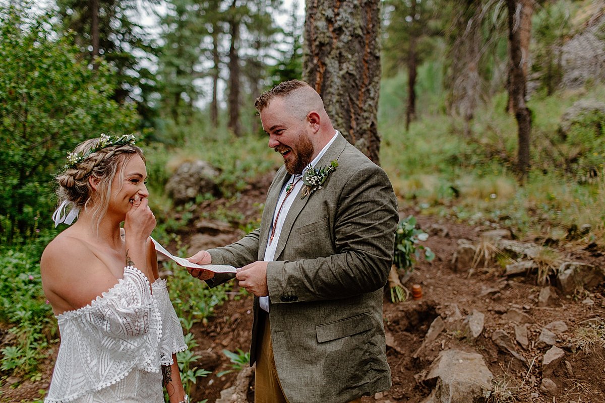  Groom reading vows to Bride during mountain ceremony in Arizona at Greer Elopement 