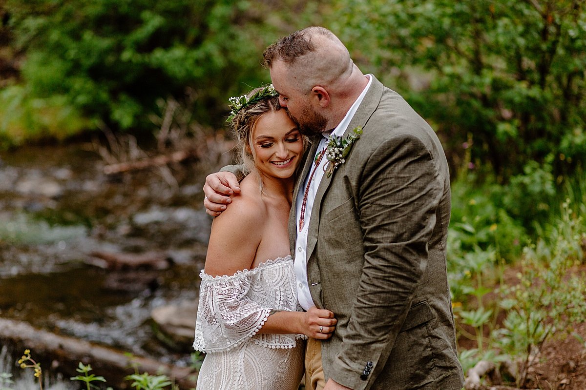  After newlyweds share first kiss during elopement in the woods  by Lucy Bouman 