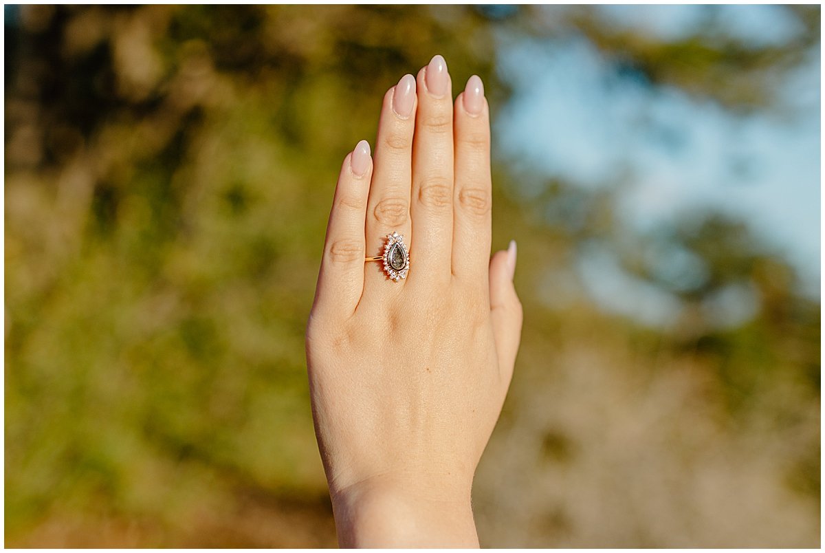  Hand with engagement ring by Lucy Bouman Photography 