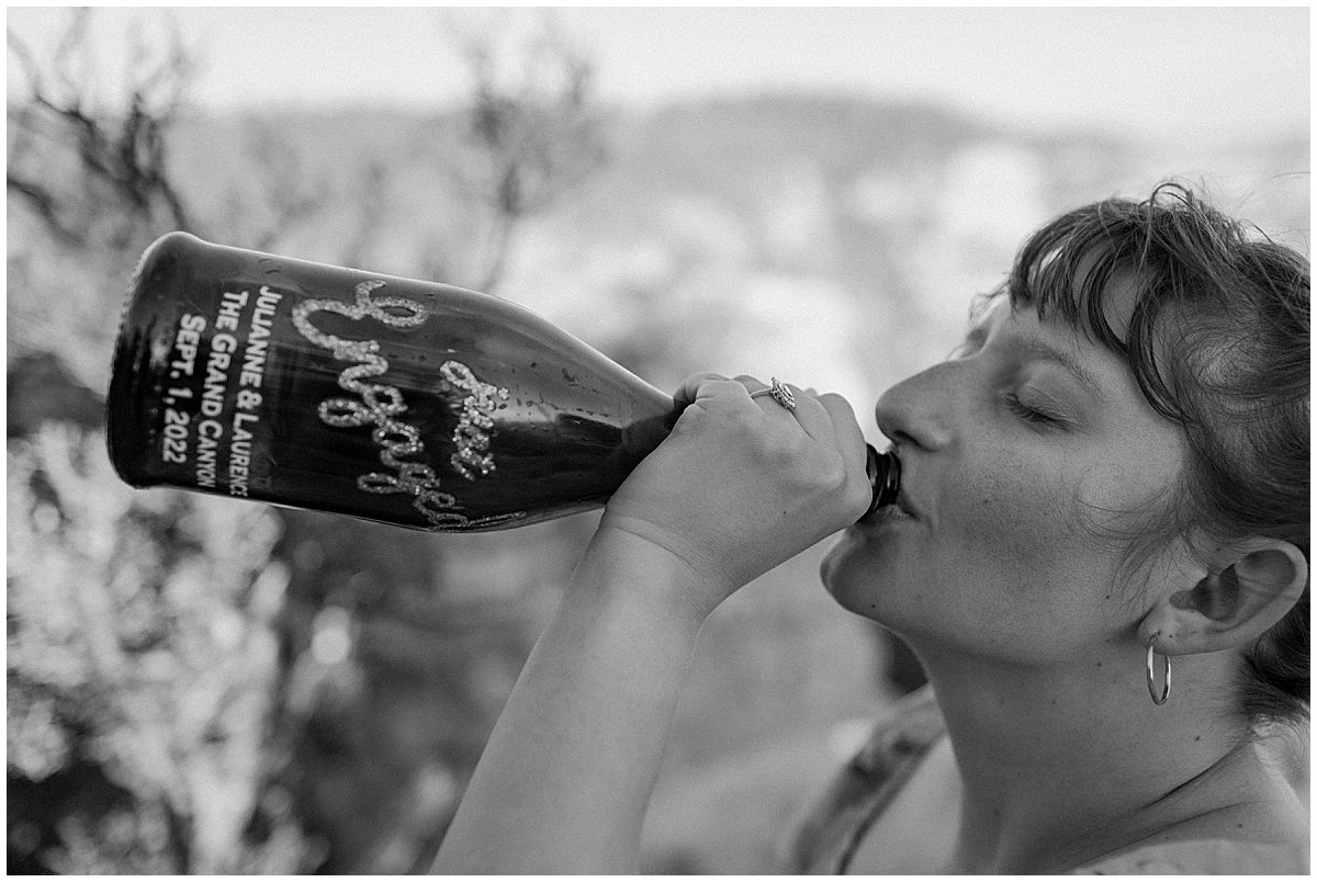  Woman drinks from personalized champagne bottle for Arizona Couples Photographer 