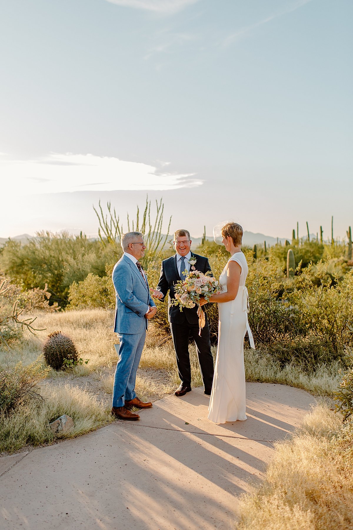  Bride and groom say I Do in front of cactus by Tucson Elopement photographer 