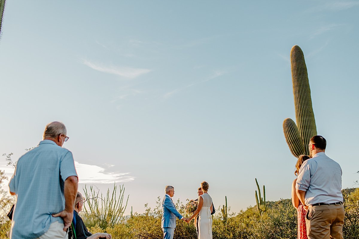  Guests watch ceremony outdoors by Tucson Elopement photographer 