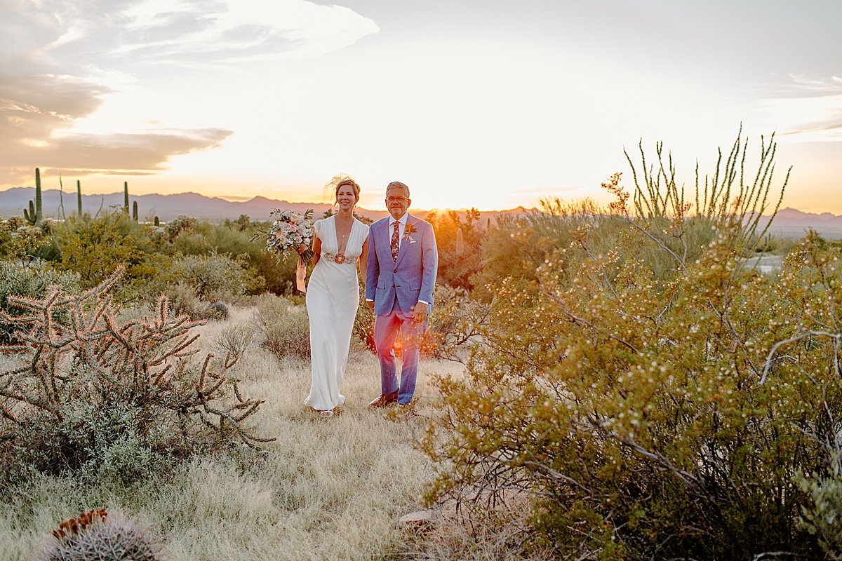  Man and woman standing in golden hour lighting  by Lucy Bouman Photography 