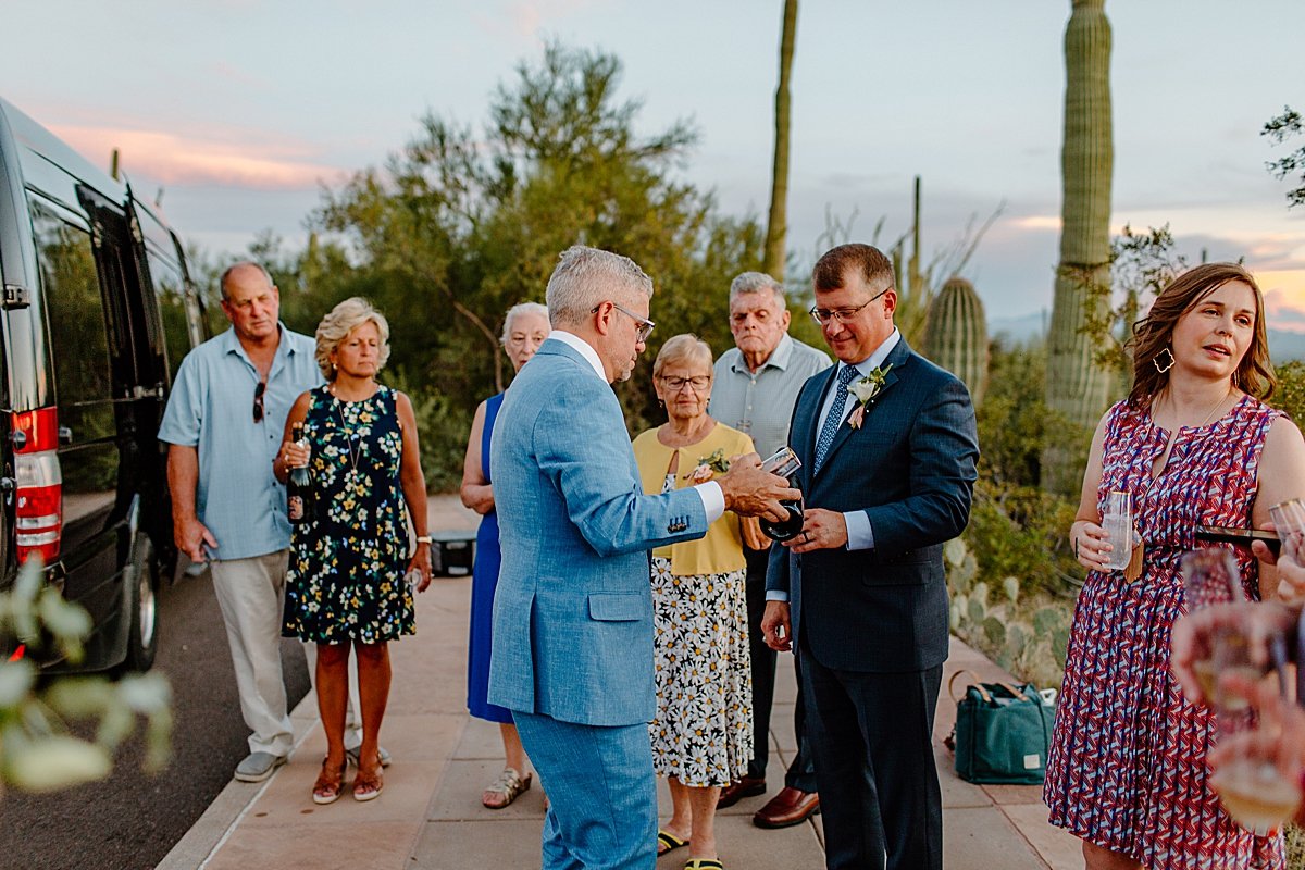  Wedding guests mingle outside at reception  by Lucy Bouman Photography 