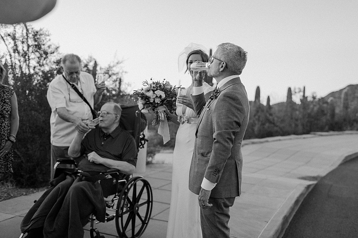  Guests celebrate newlyweds at micro wedding  by Tuscon Elopement photographer 