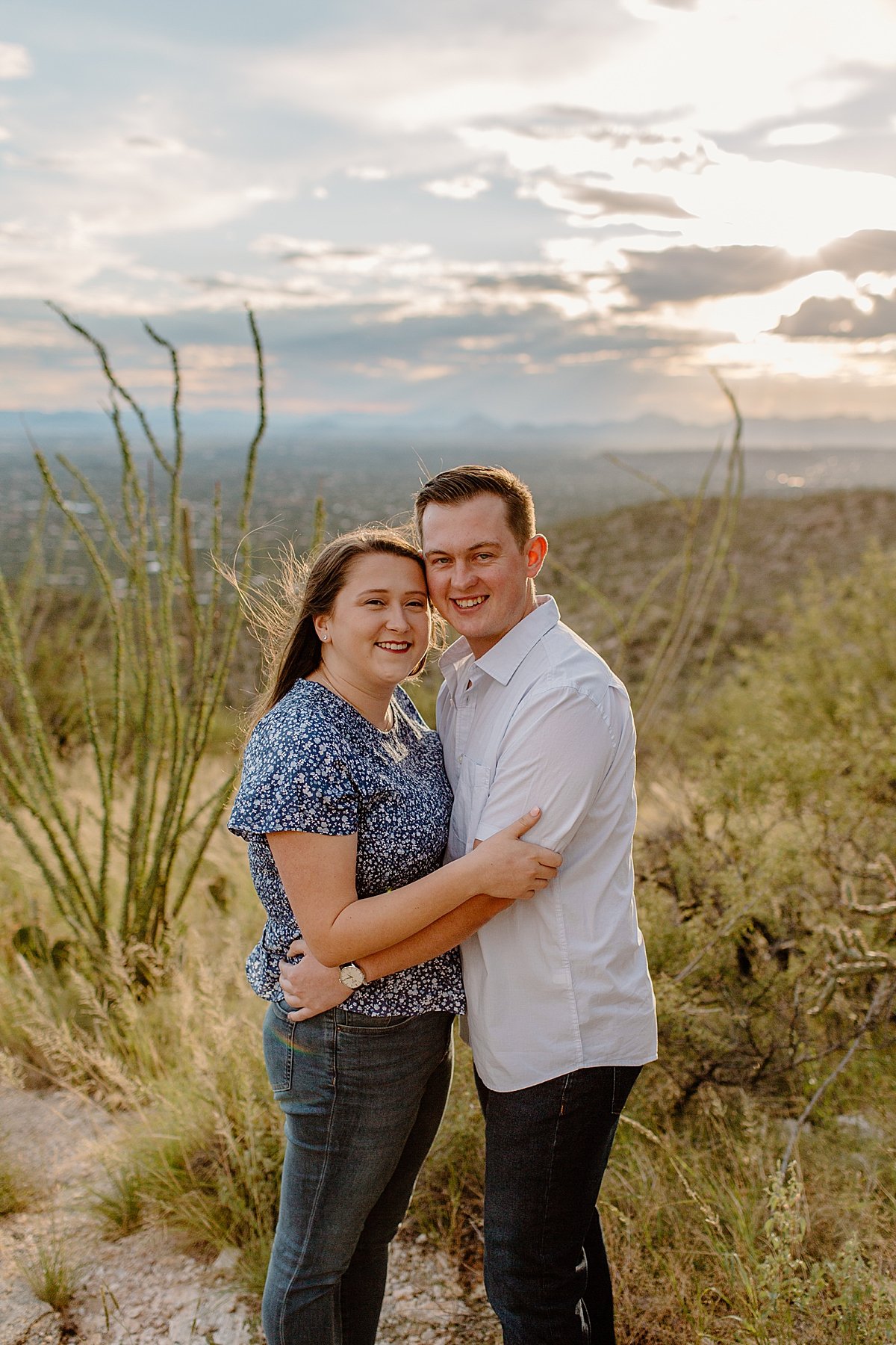  fiances hug each other close by Arizona engagement photographer 
