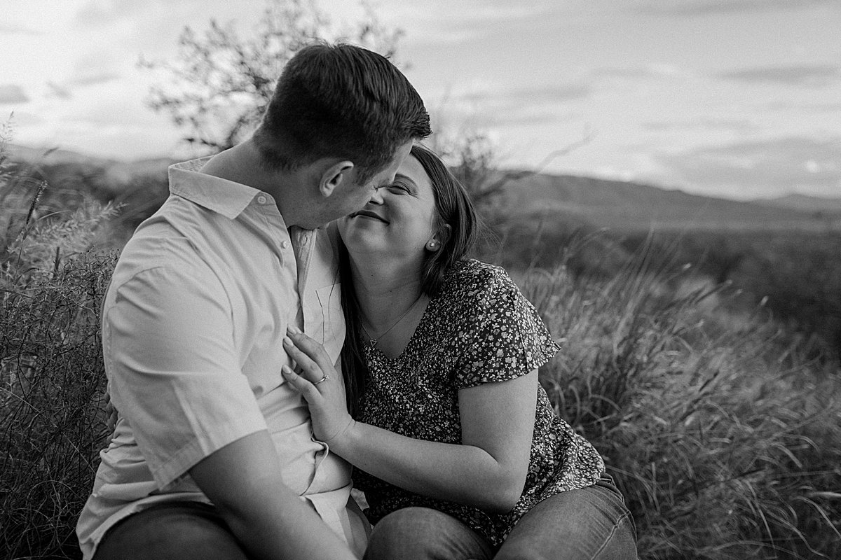  guy and girl lean close and look at each other by Lucy B Photography 