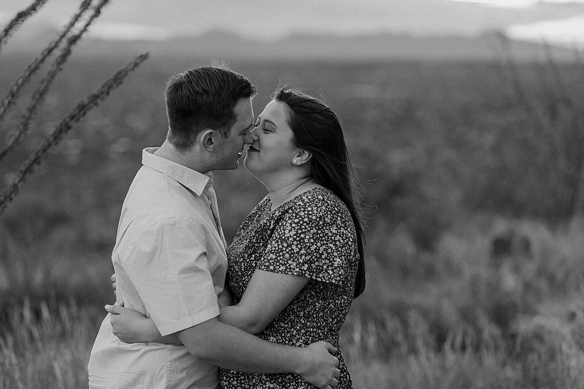  fiances embrace and kiss for Arizona engagement photographer 
