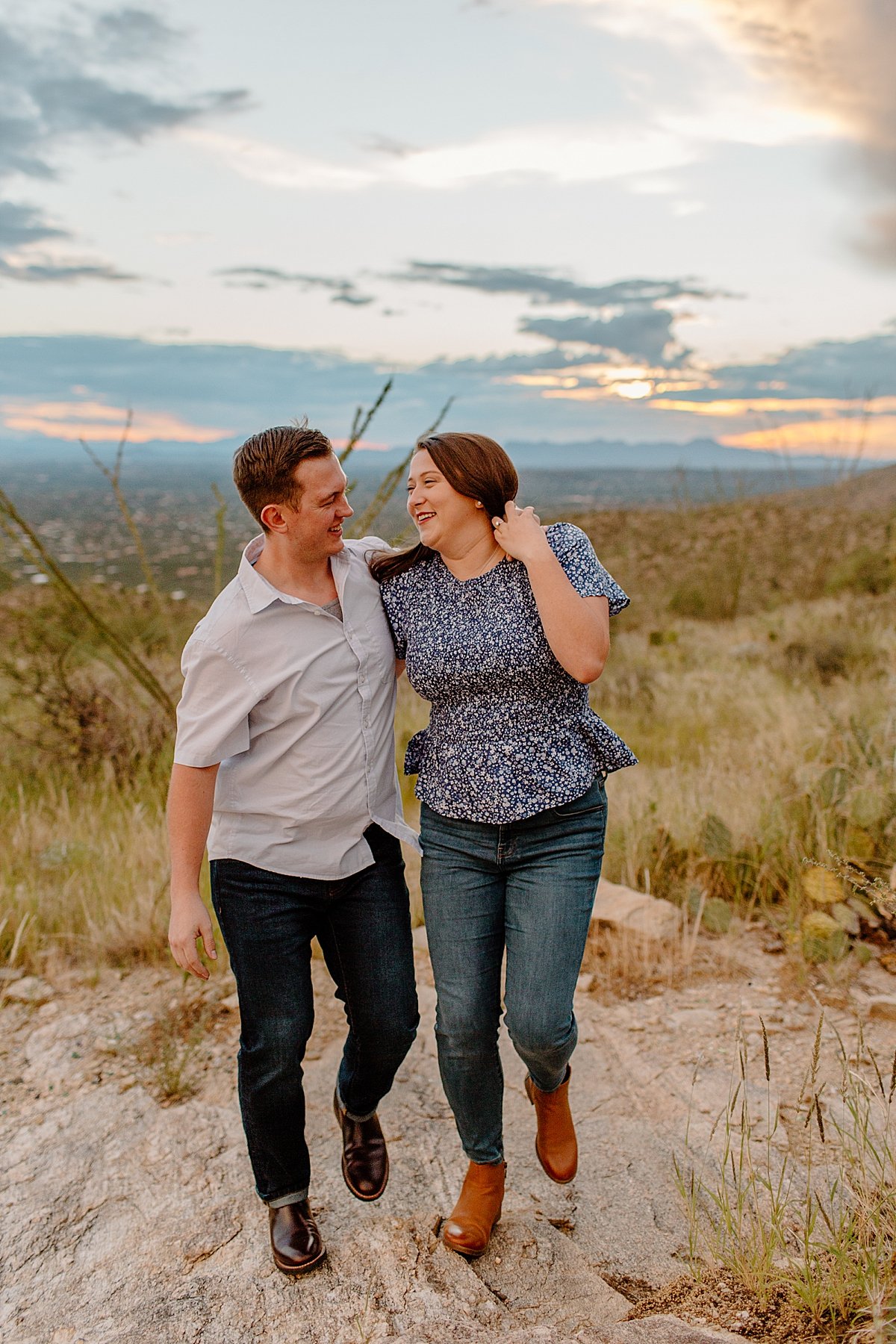  couple walks with arms around each other at  Mount Lemmon session 