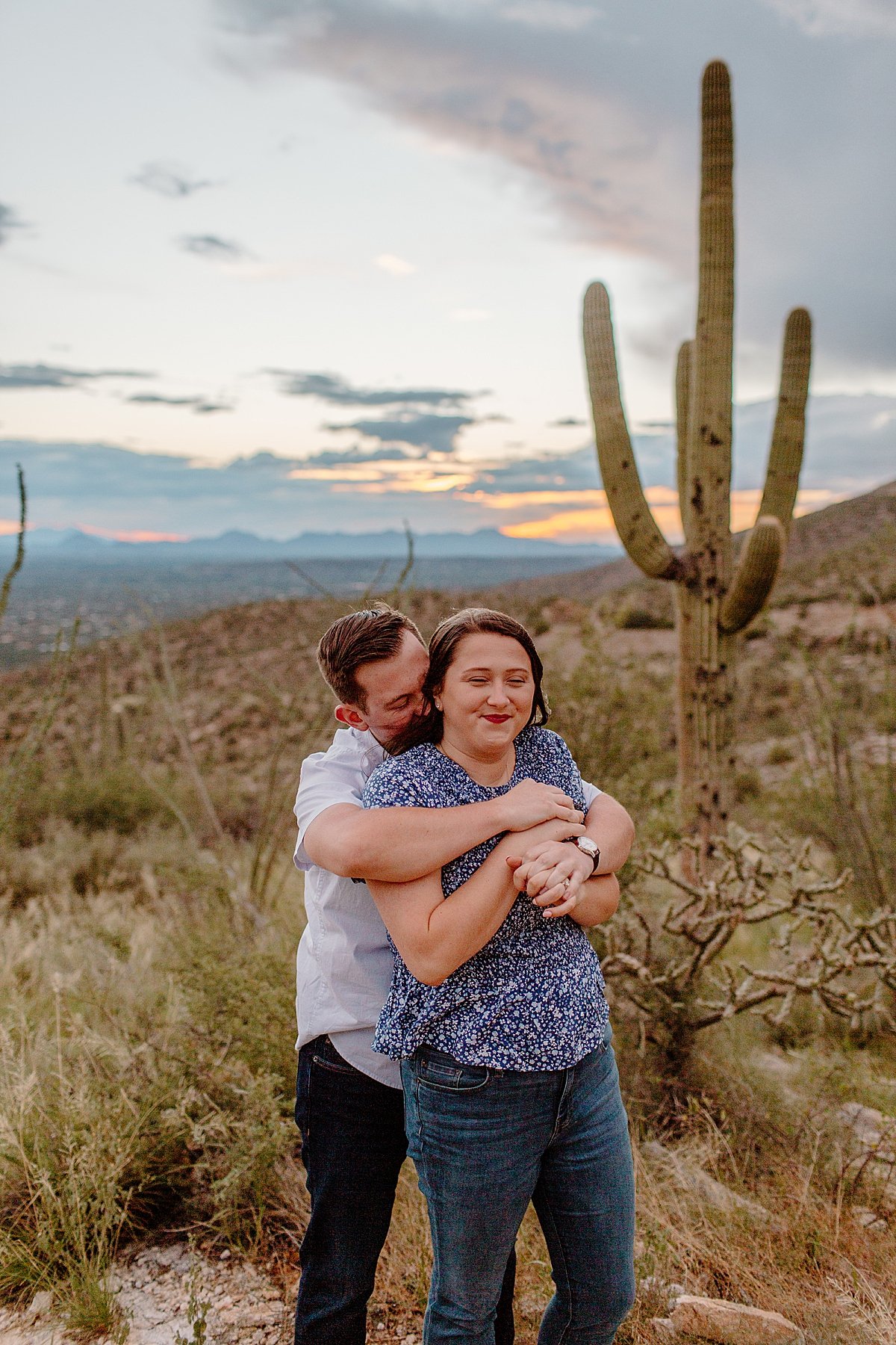  man hugs woman from behind for Lucy B Photography 