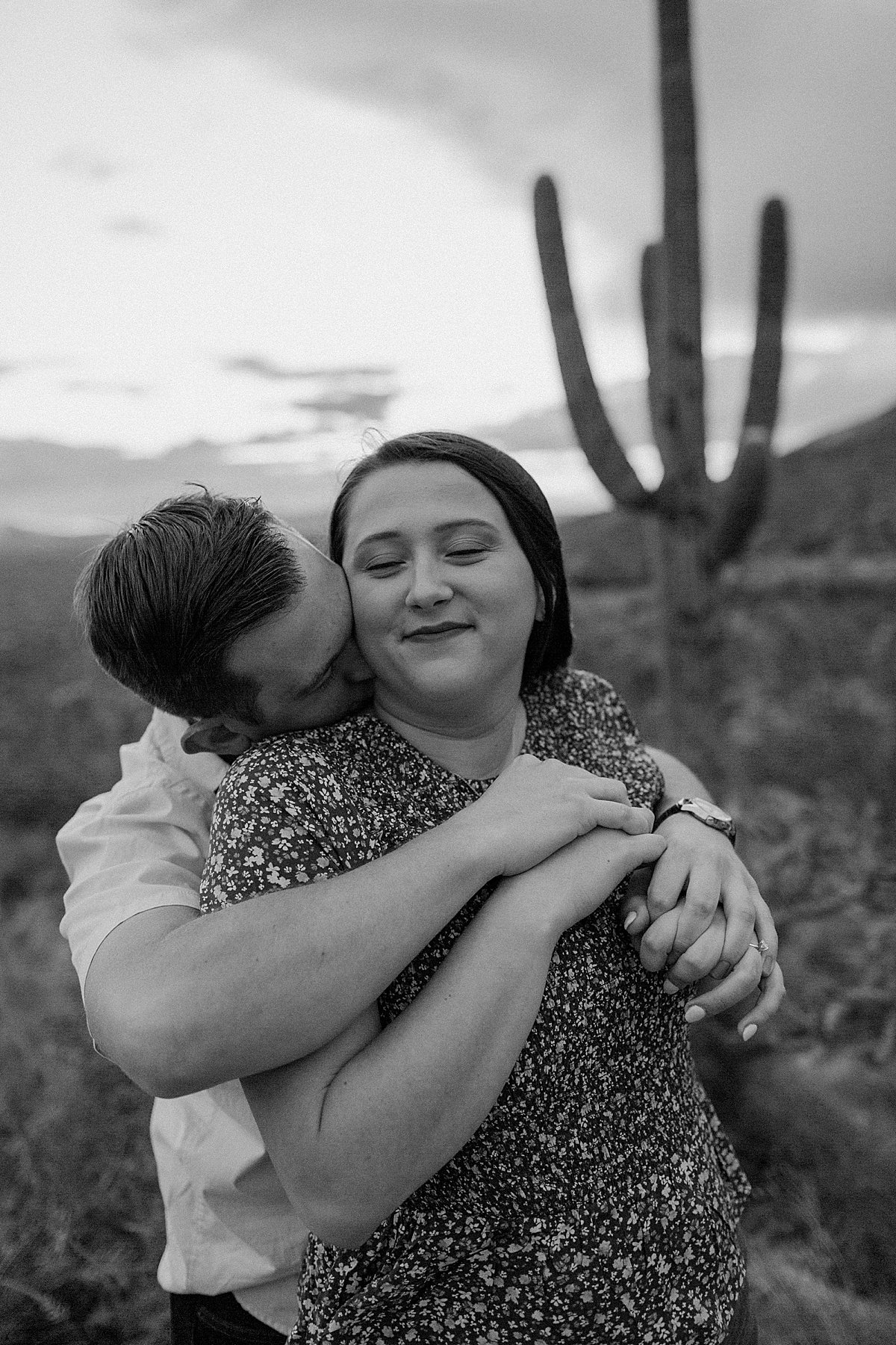  man kisses woman on neck at  Mount Lemmon session 