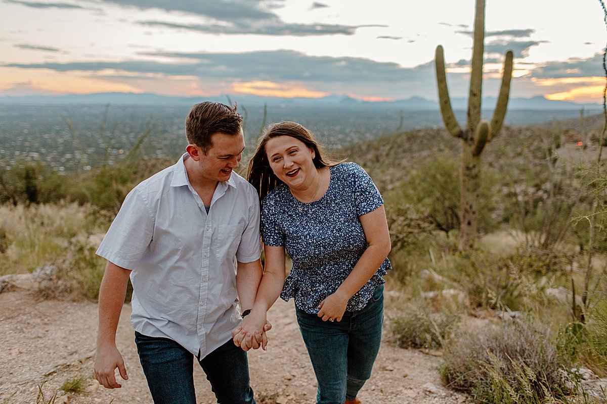  fiances walk together hand in hand for Arizona engagement photographer 
