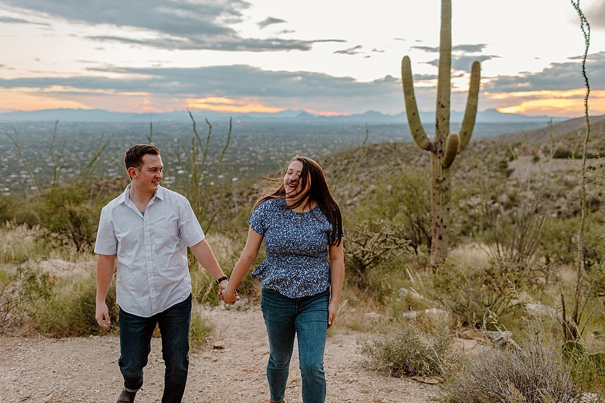  couple walks holding hands at  Mount Lemmon session 