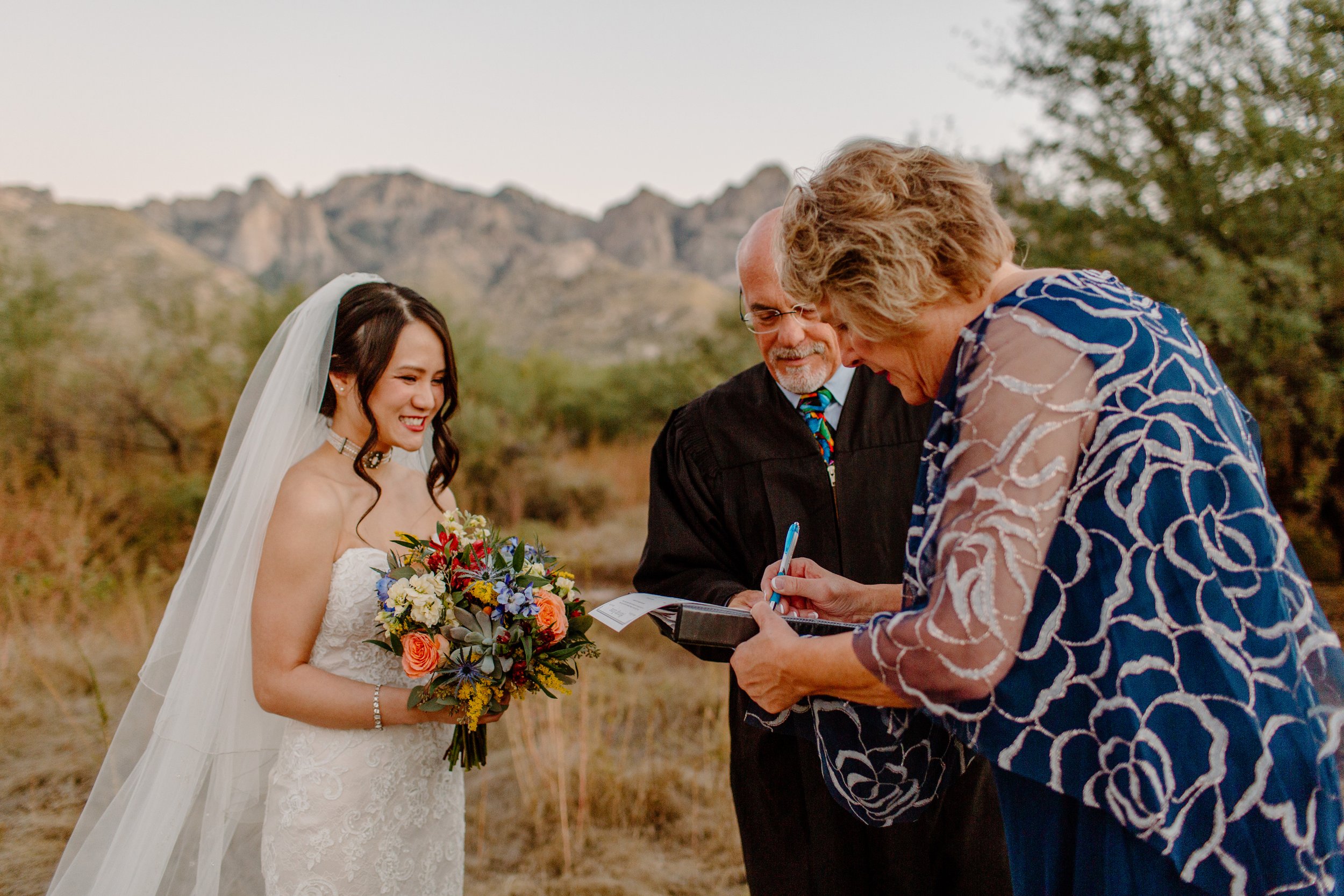  witnesses sign marriage license after intimate ceremony by Arizona elopement photographer  