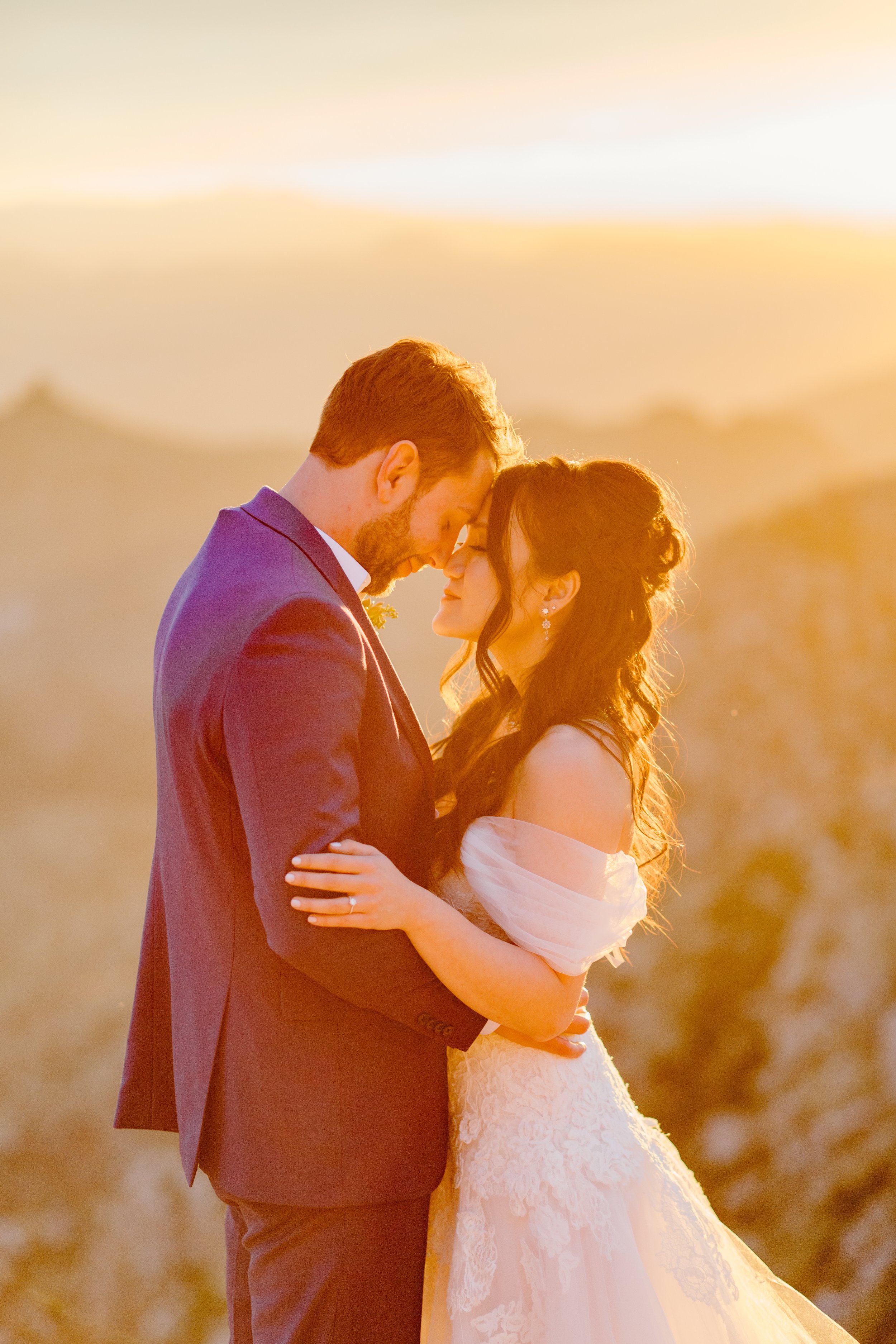  man and woman forehead to forehead at golden hour sunset by Arizona elopement photographer 