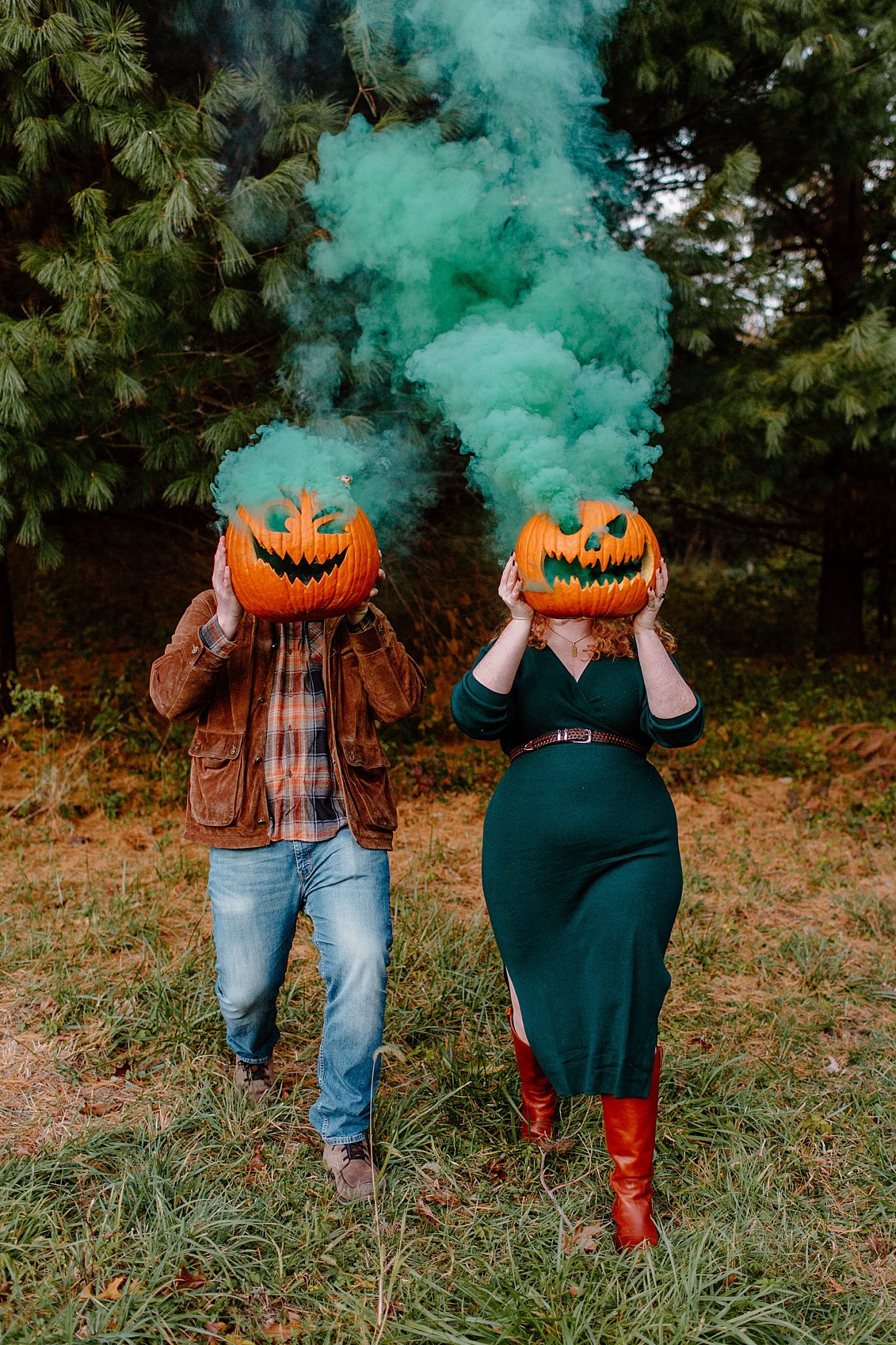  Smoke spills out of jack-o-lanterns at Halloween engagement session 