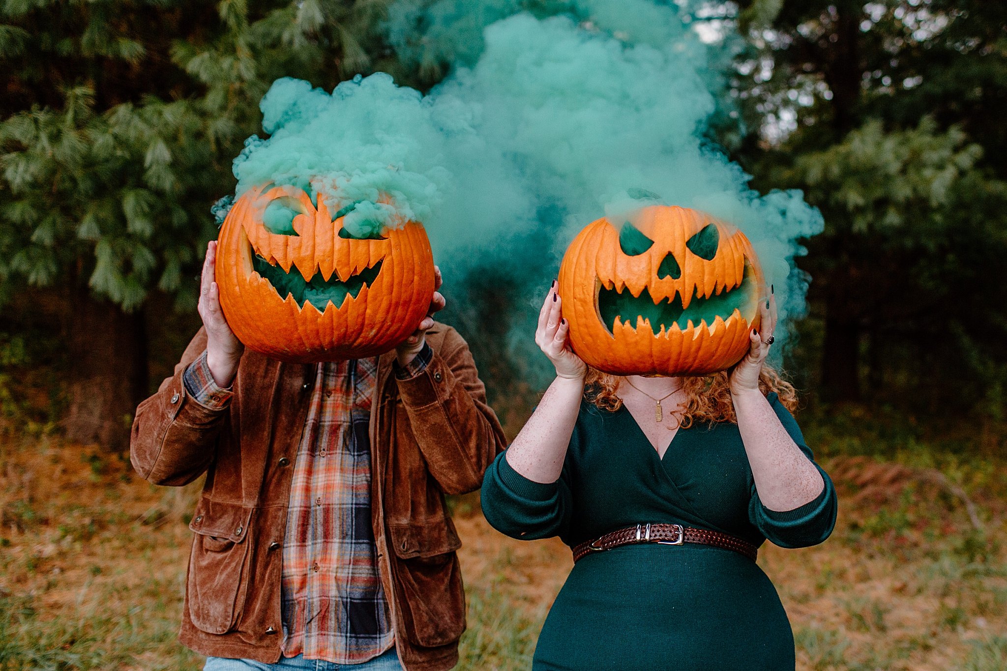  jack-o-lanterns cover heads of two people by Arizona elopement photographer 