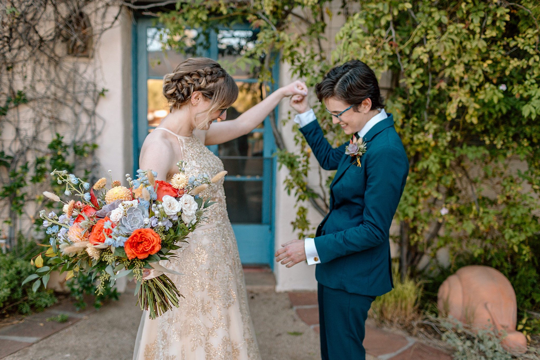  partner looks at bride’s dress by Lucy B Photography 