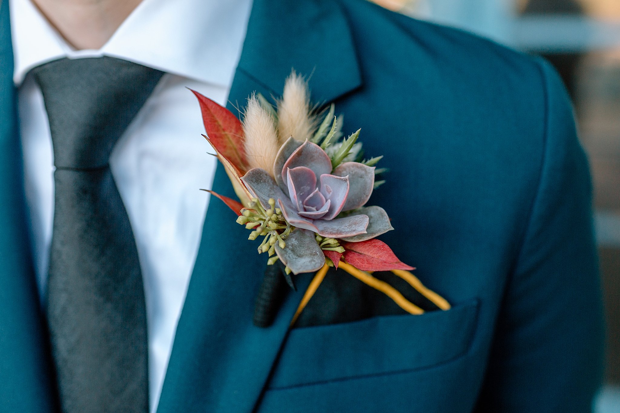  boutonniere on lapel of suit by Arizona wedding photographer 