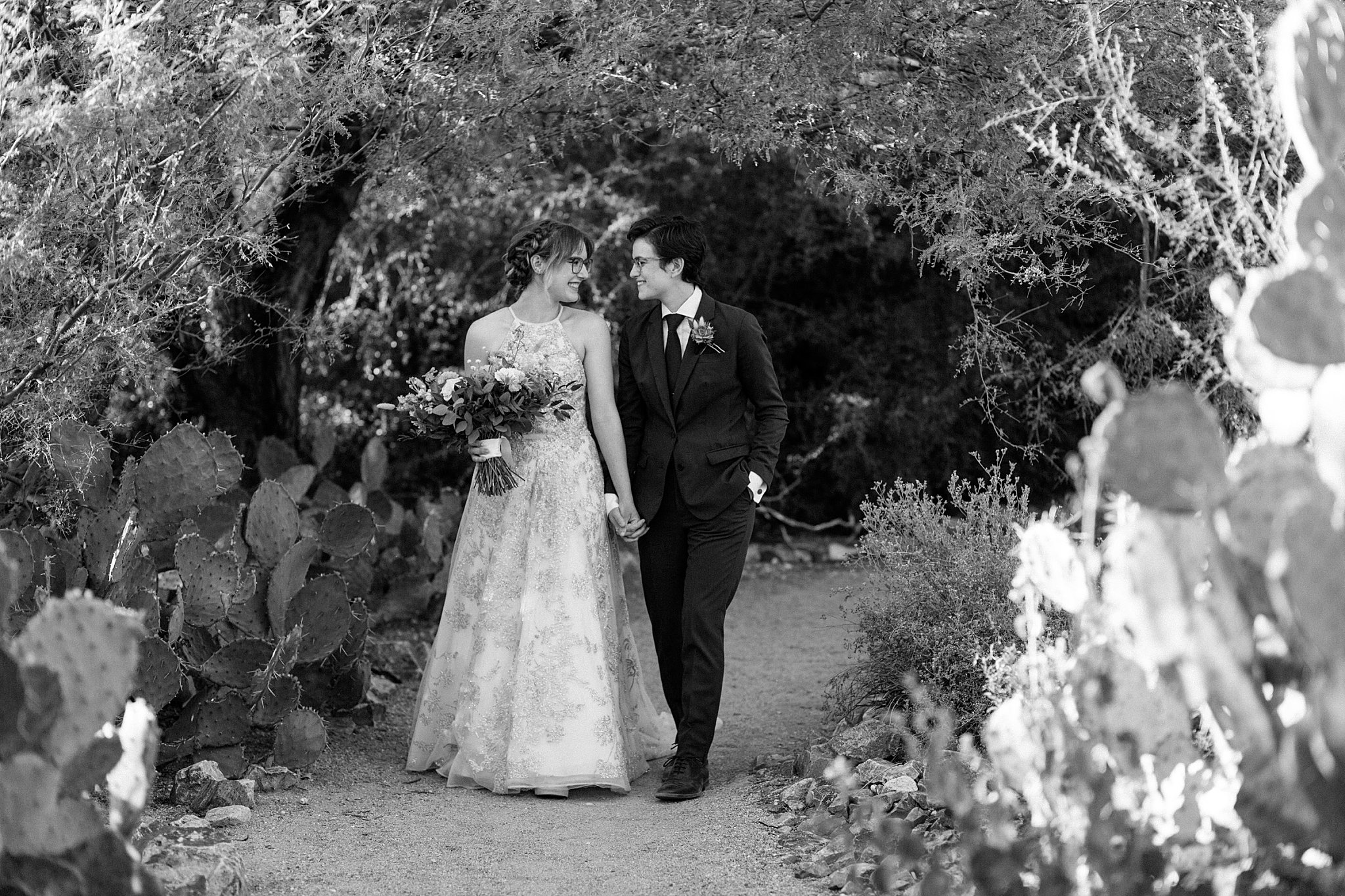  partners walk down path looking at each other by Lucy B Photography 