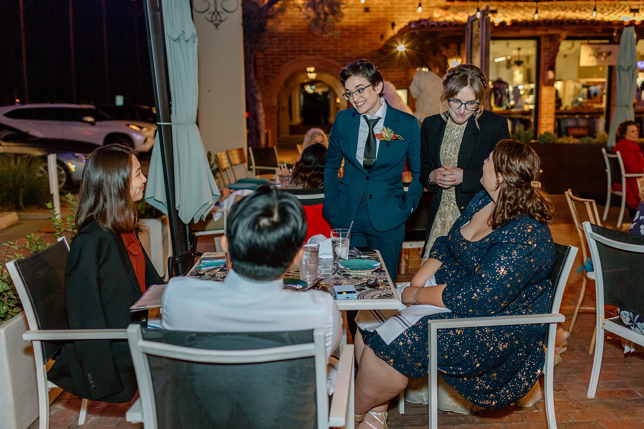  newlyweds visit with guests at reception by Arizona wedding photographer 
