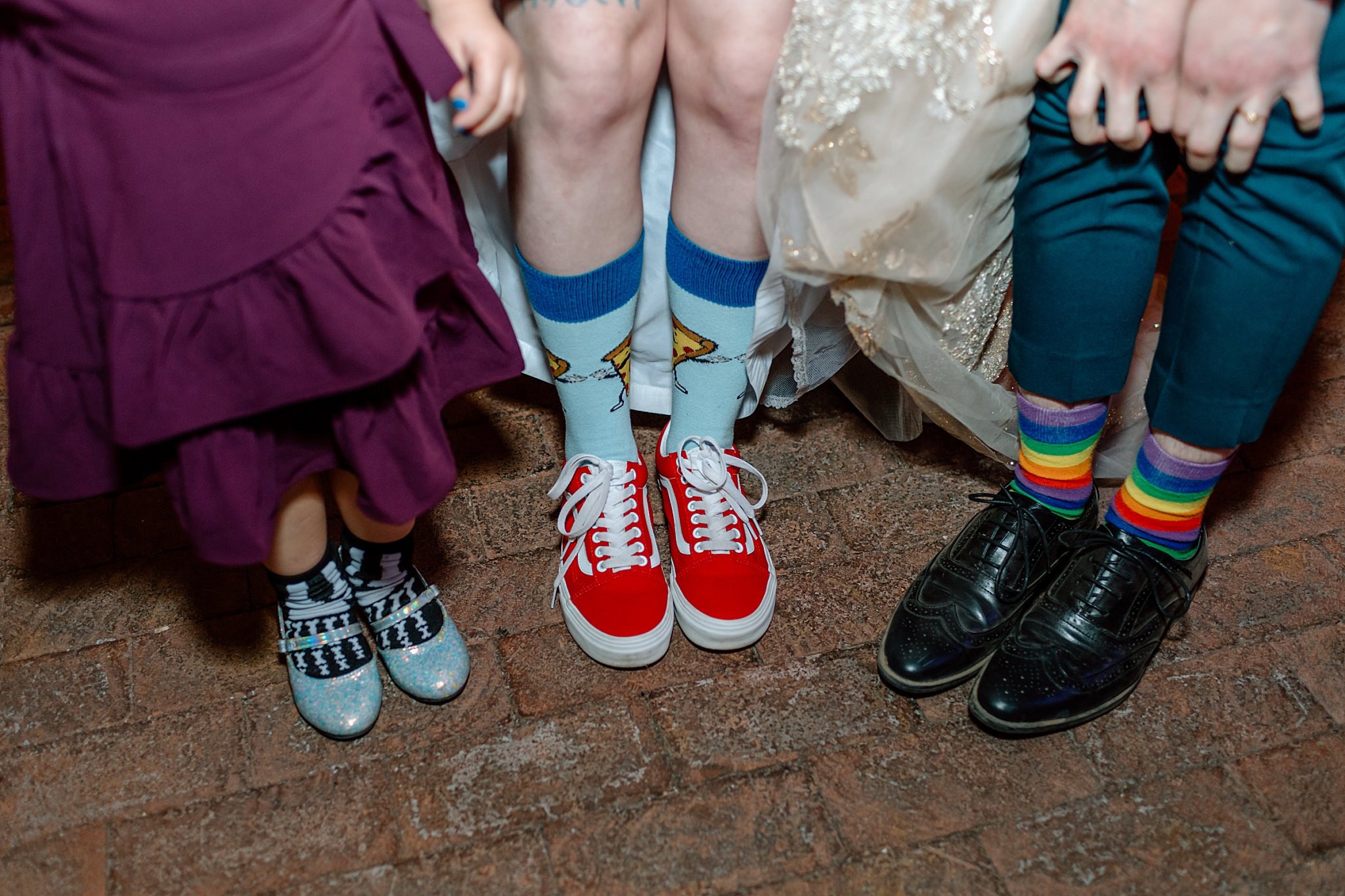  three people show off socks by Arizona wedding photographer 