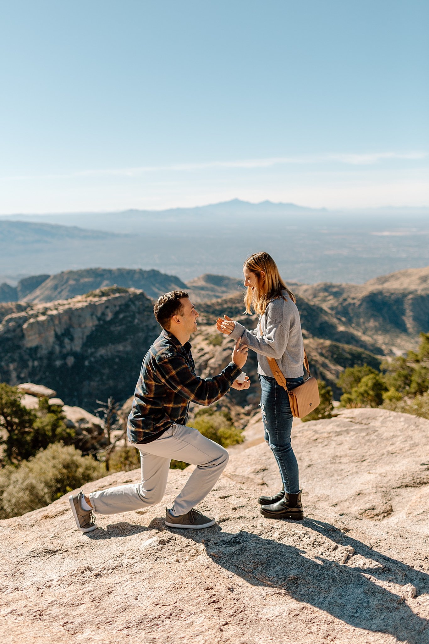  boyfriend is down on one knee at ask to marry girlfriend by Arizona engagement photographer 
