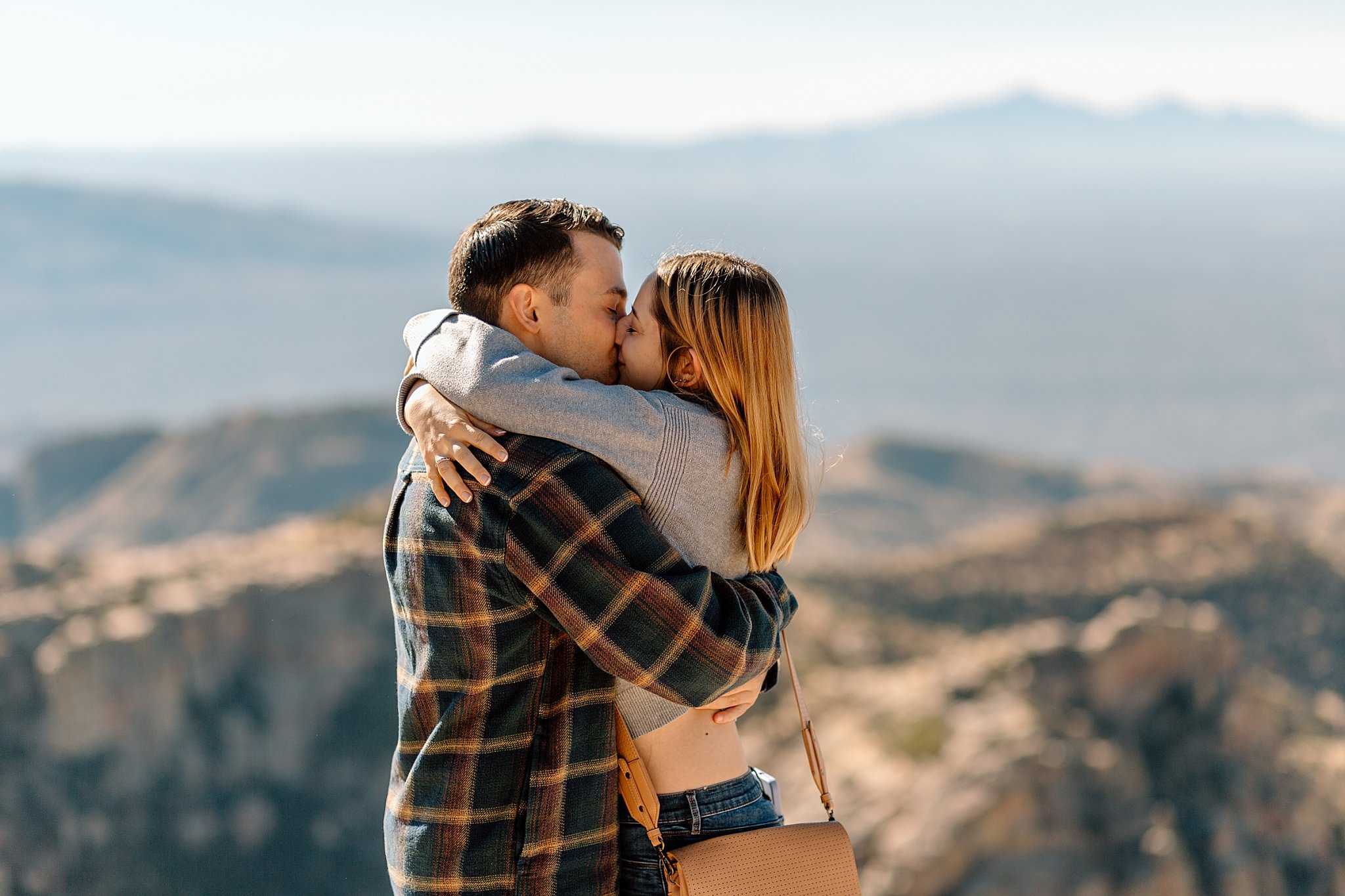  couple hugs and kisses by Arizona engagement photographer 