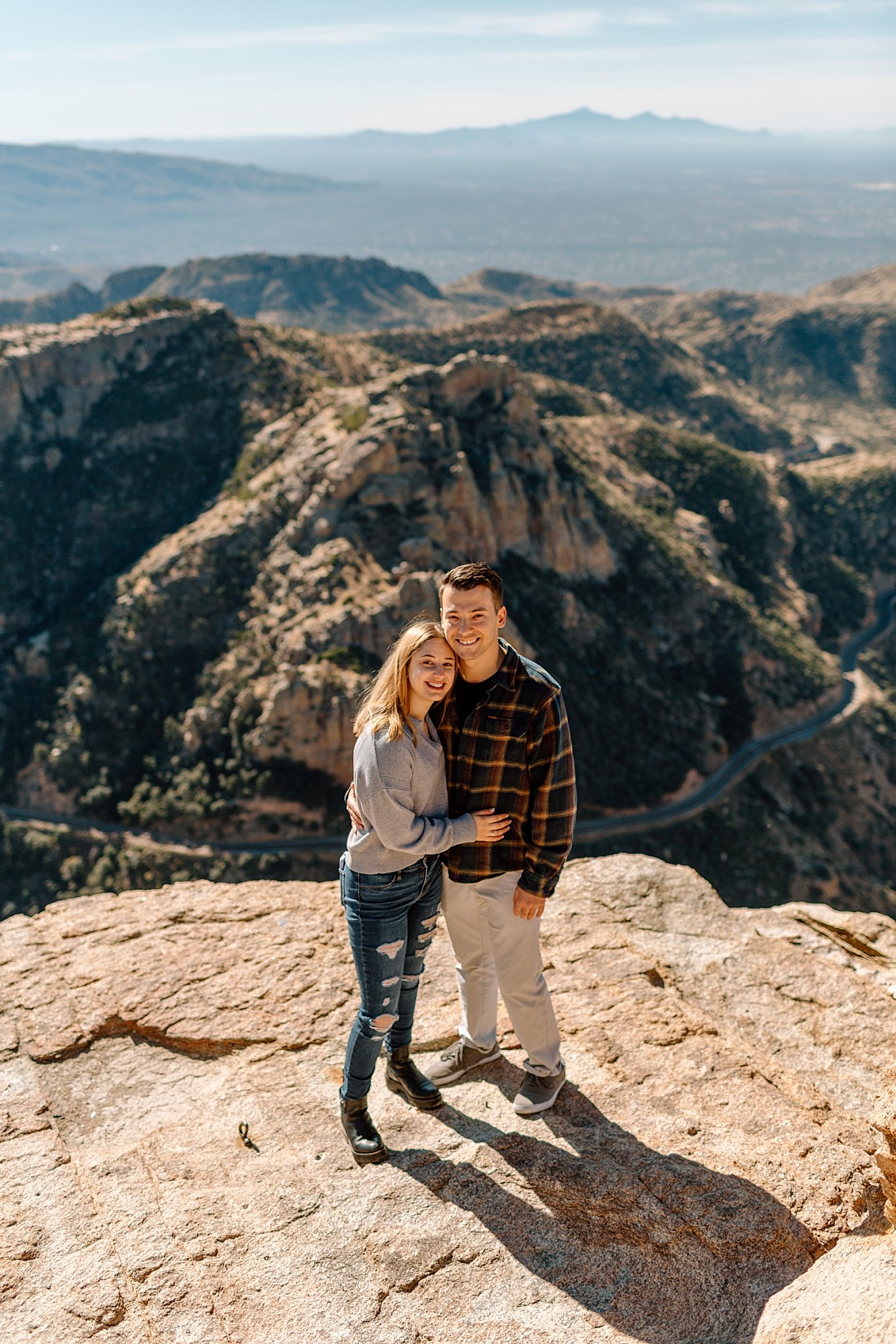  man and woman embrace each other at Mount Lemmon proposal 