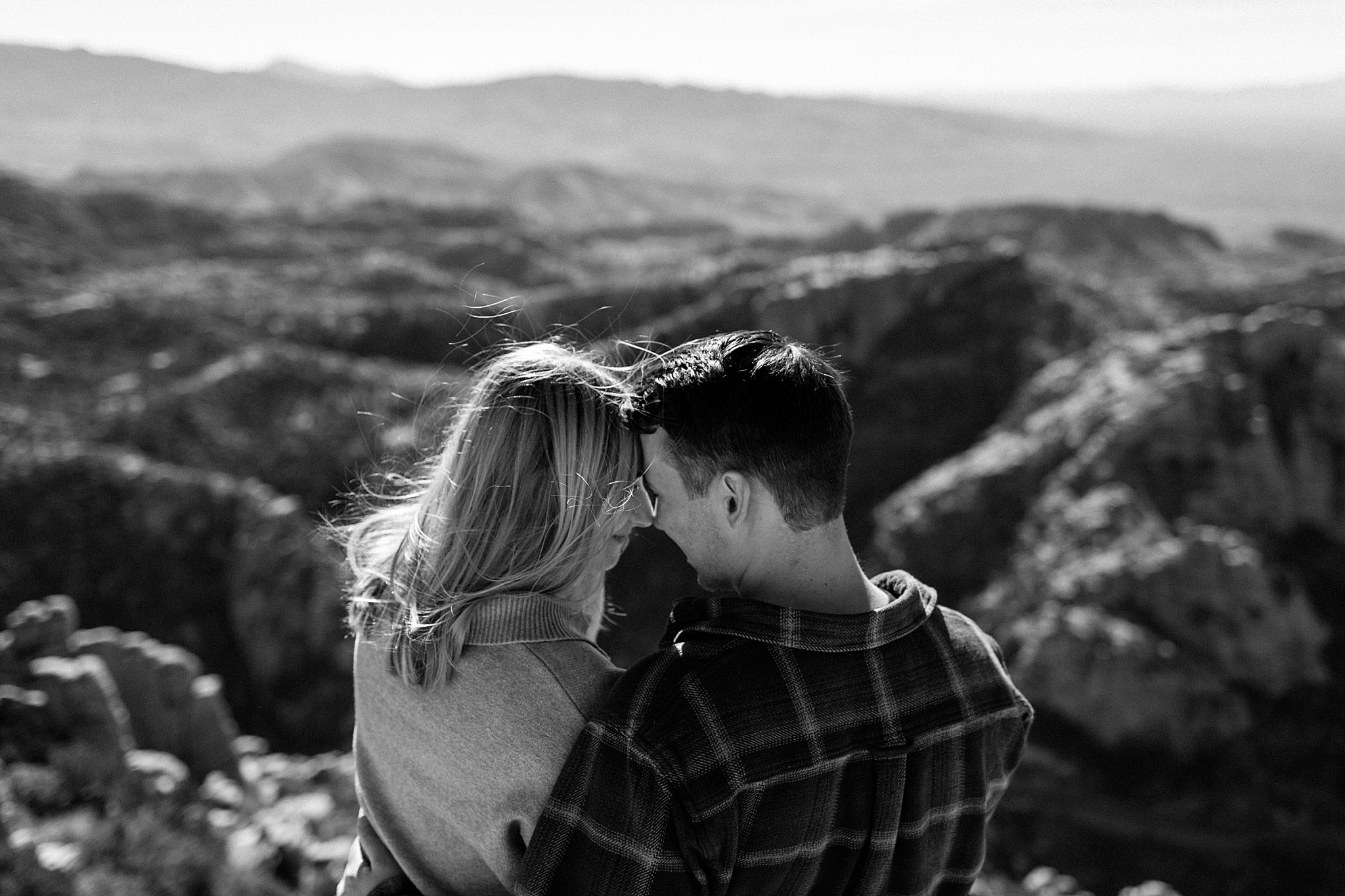  couple leans together to touch foreheads by Arizona engagement photographer 