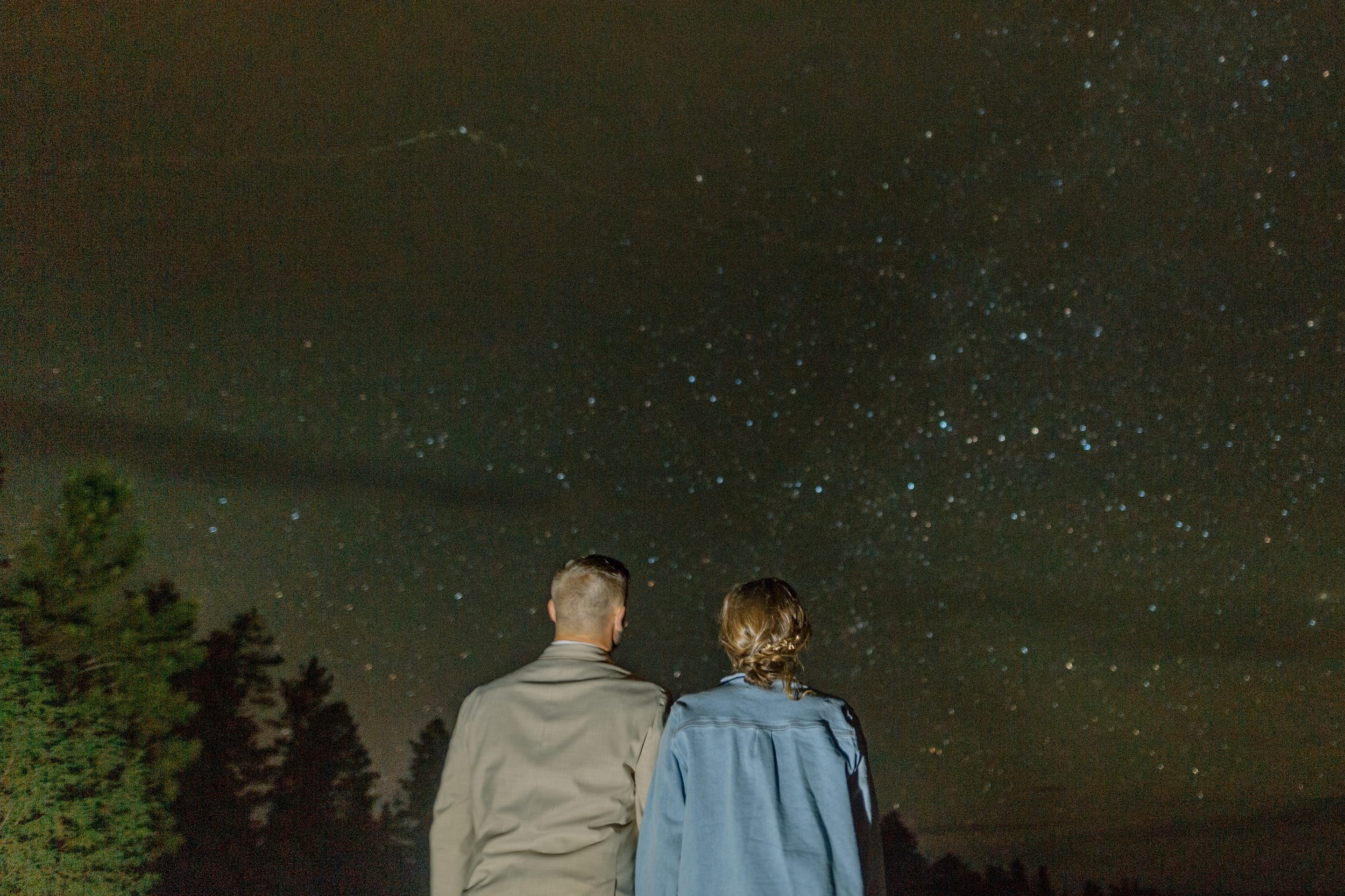  elopement couple looks up at stars at night after utah elopement 