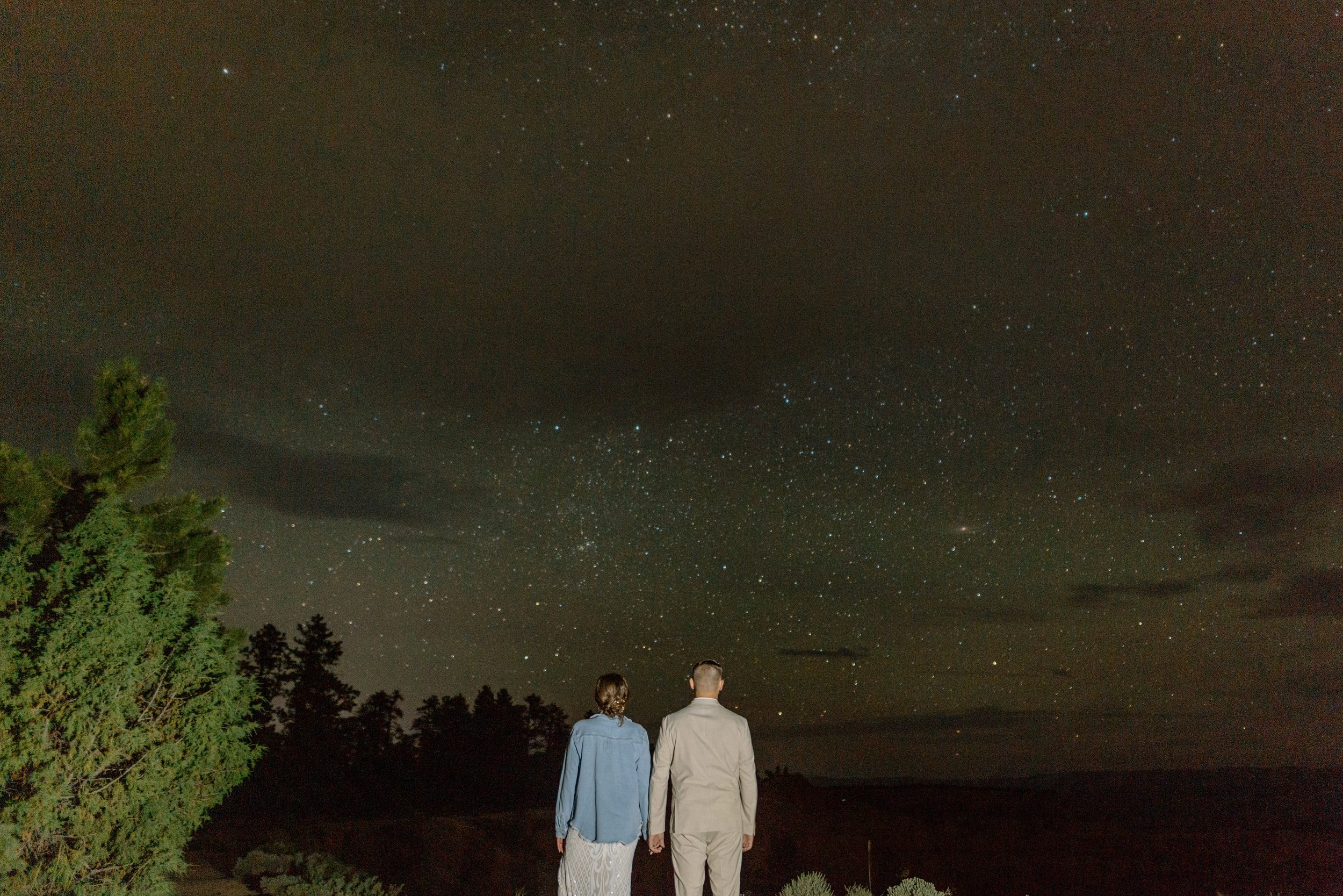  utah elopement couple looks at stars at bryce canyon national park 