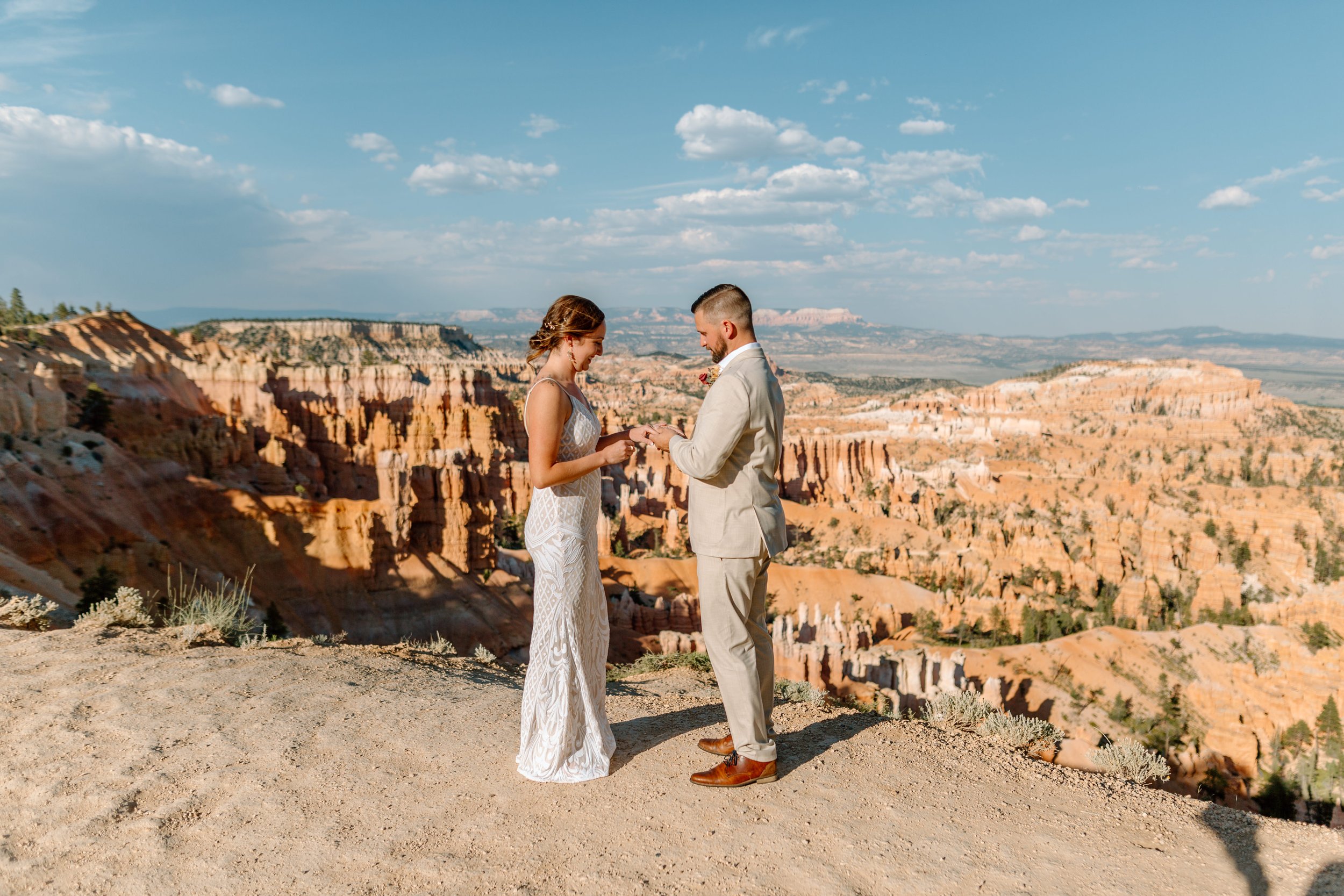 couple exchanges rings at bryce canyon national park by utah elopement photographer 