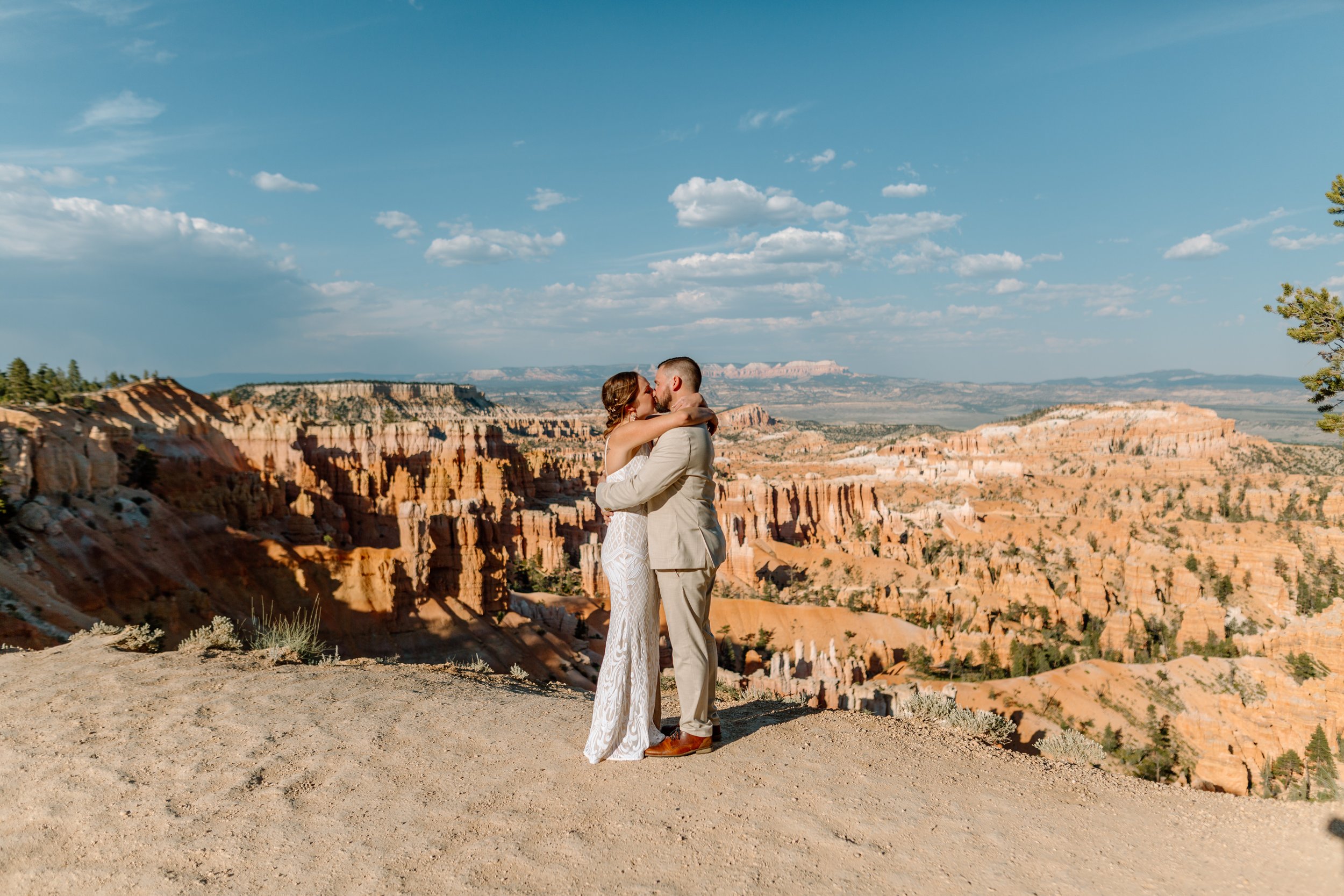  couple shares a kiss after their bryce canyon elopement ceremony 