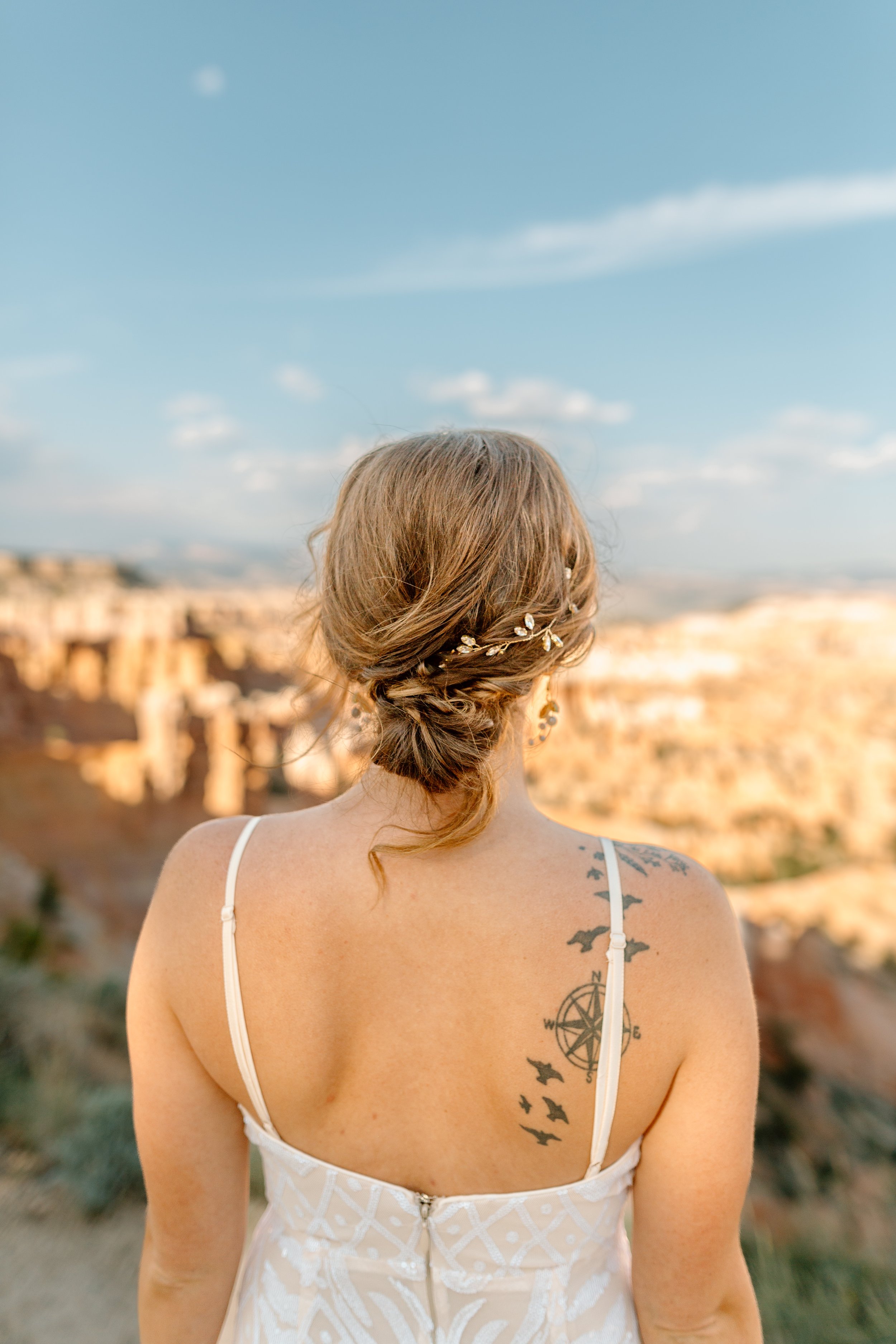  bride’s back tattoo and hairstyle during bryce canyon elopement 