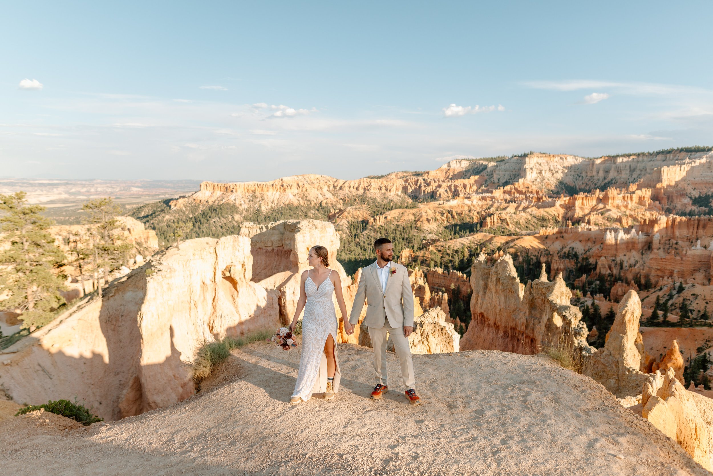  couple looks into distance at bryce canyon national park by utah elopement photographer 
