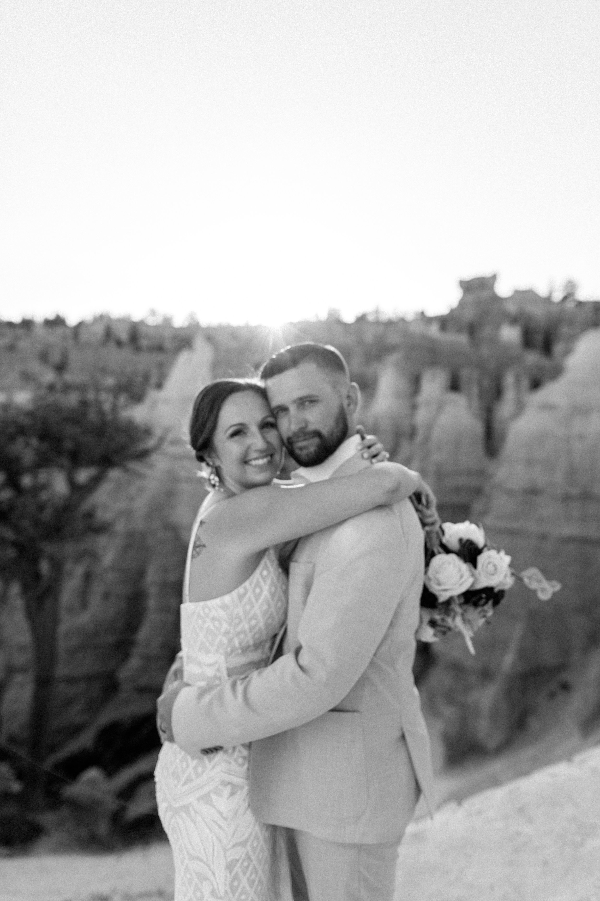  black and white photo of couple hugging and smiling during utah elopement 