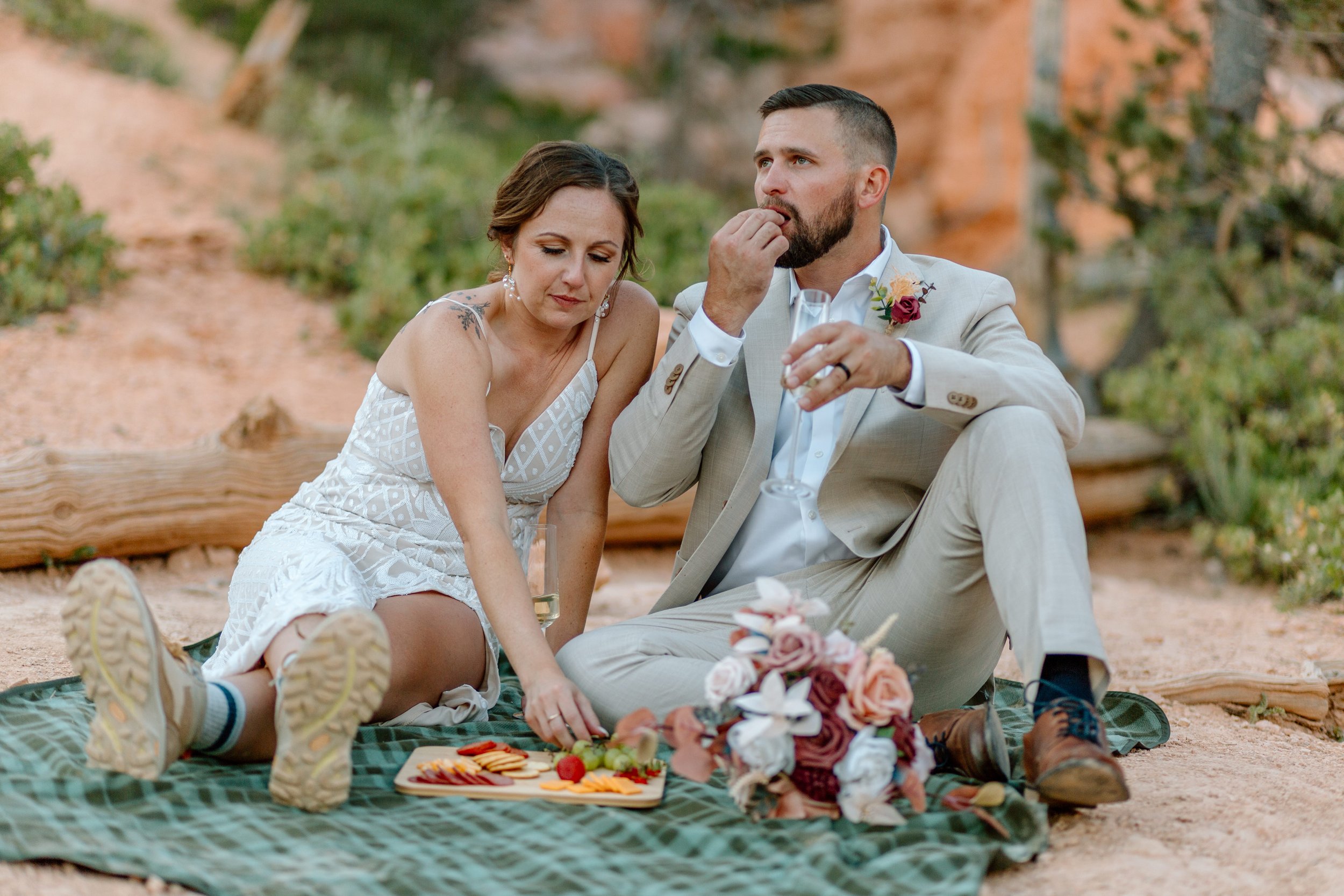  couple shares a picnic during their utah elopement 