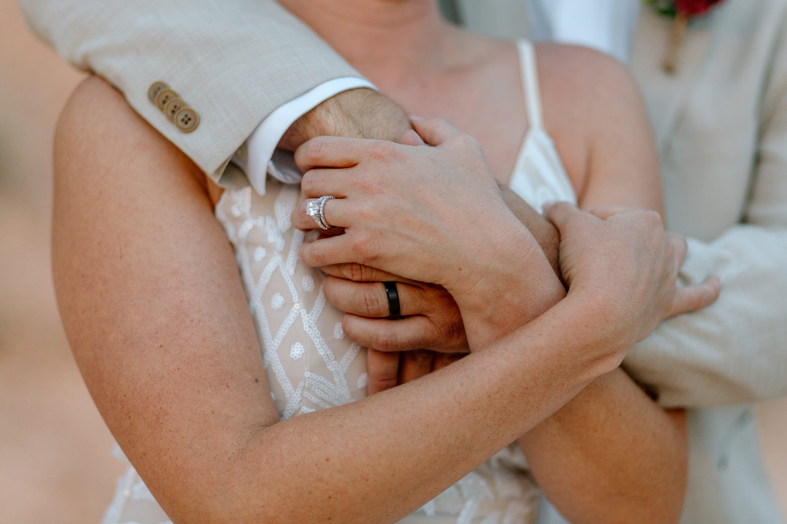  close-up of couple’s hands holding each other by utah elopement photographer 