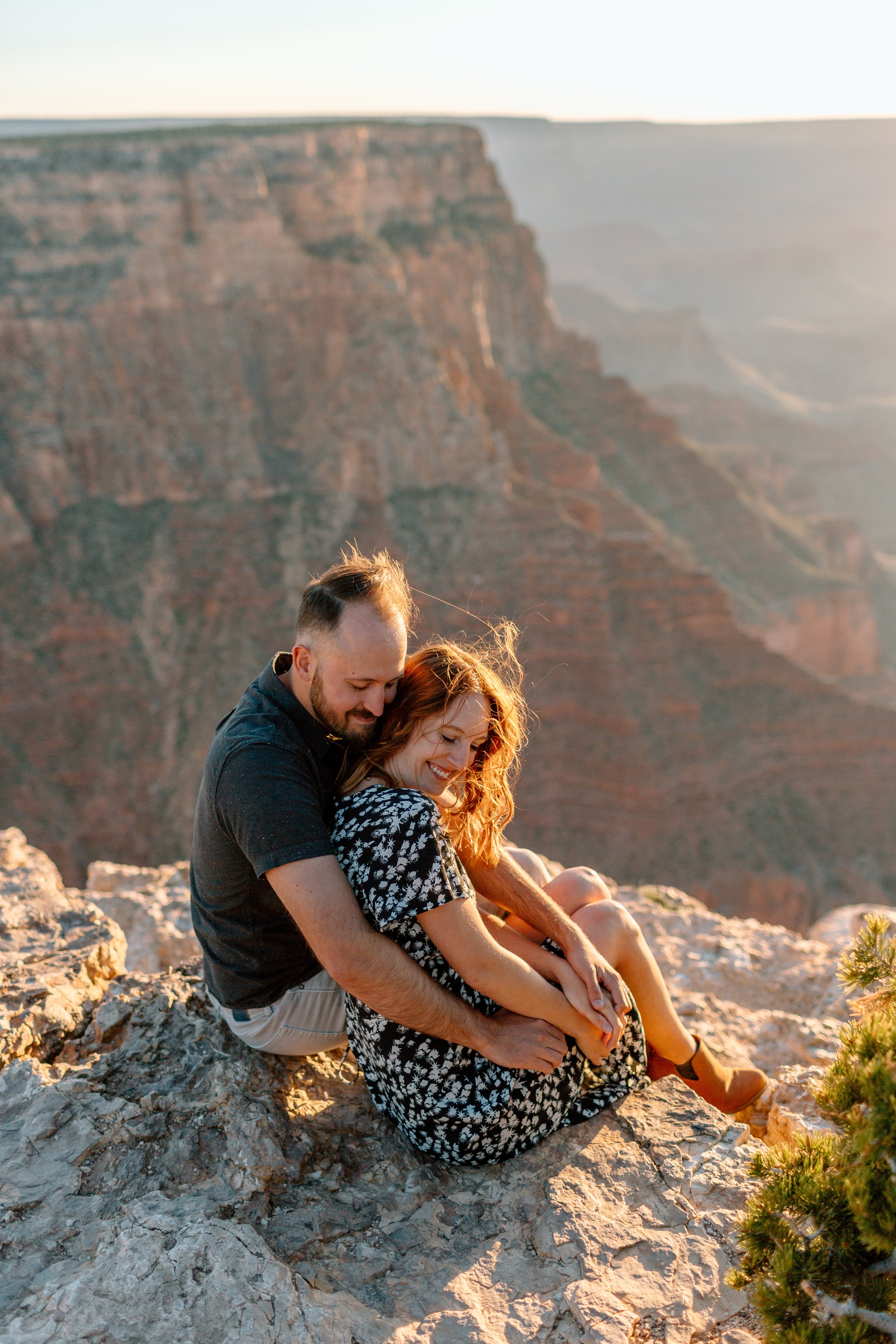  couple snuggles during their engagement session with arizona elopement photographer 