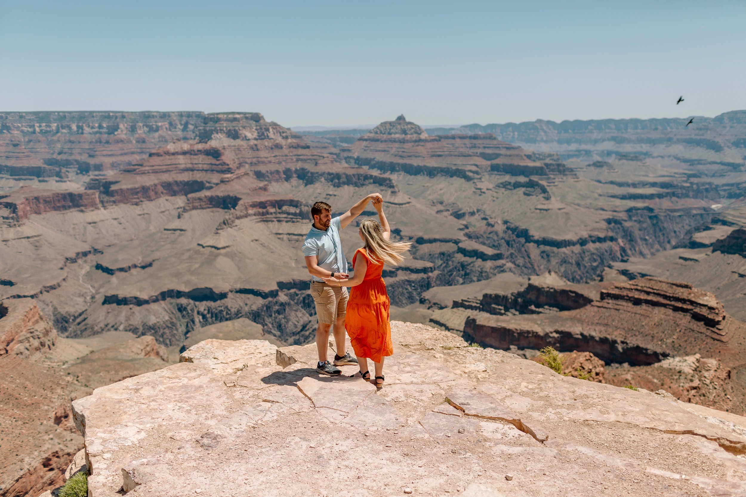  couple dances as ravens fly over the grand canyon 