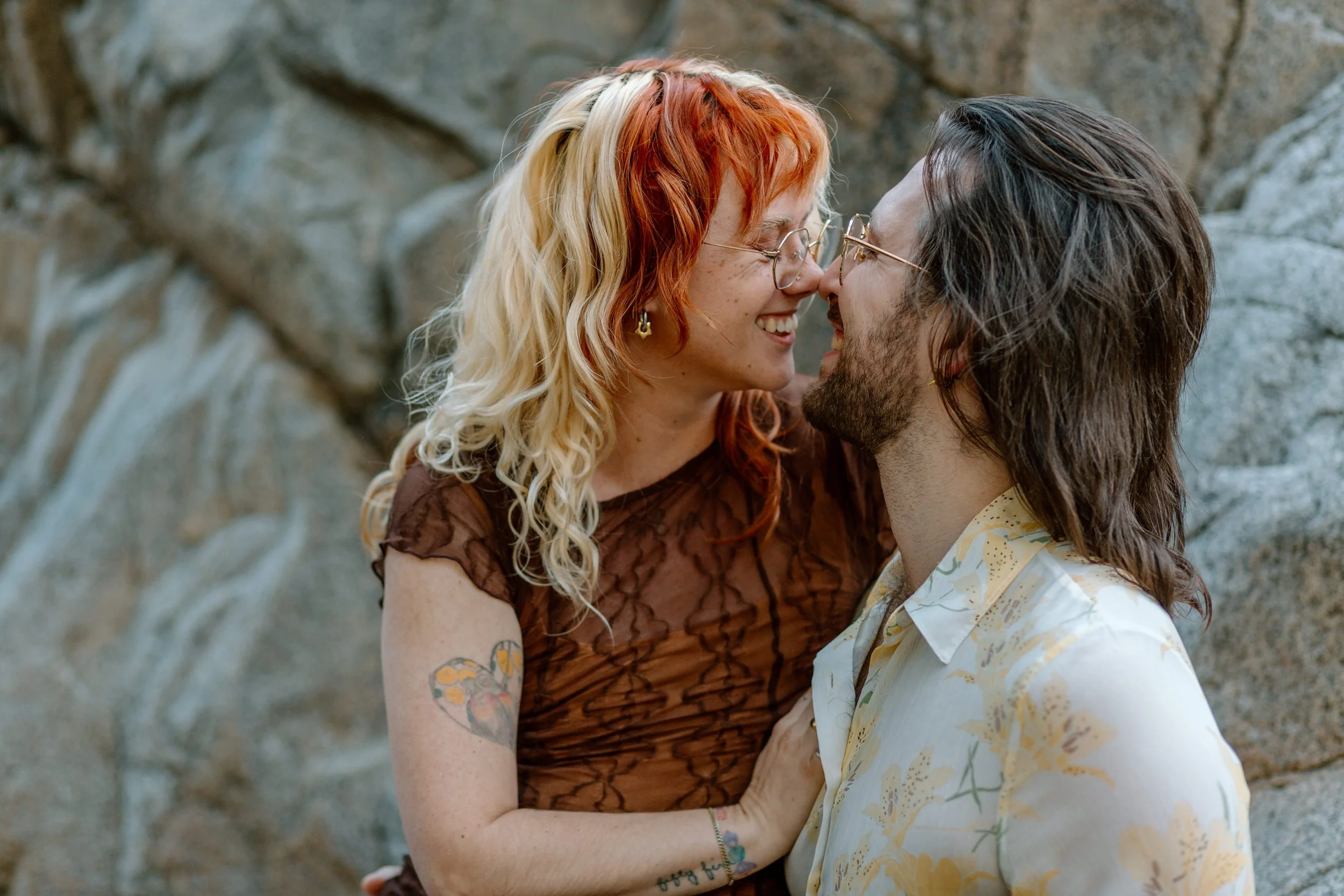  couple touches noses together and smiles by Tucson engagement photographer 