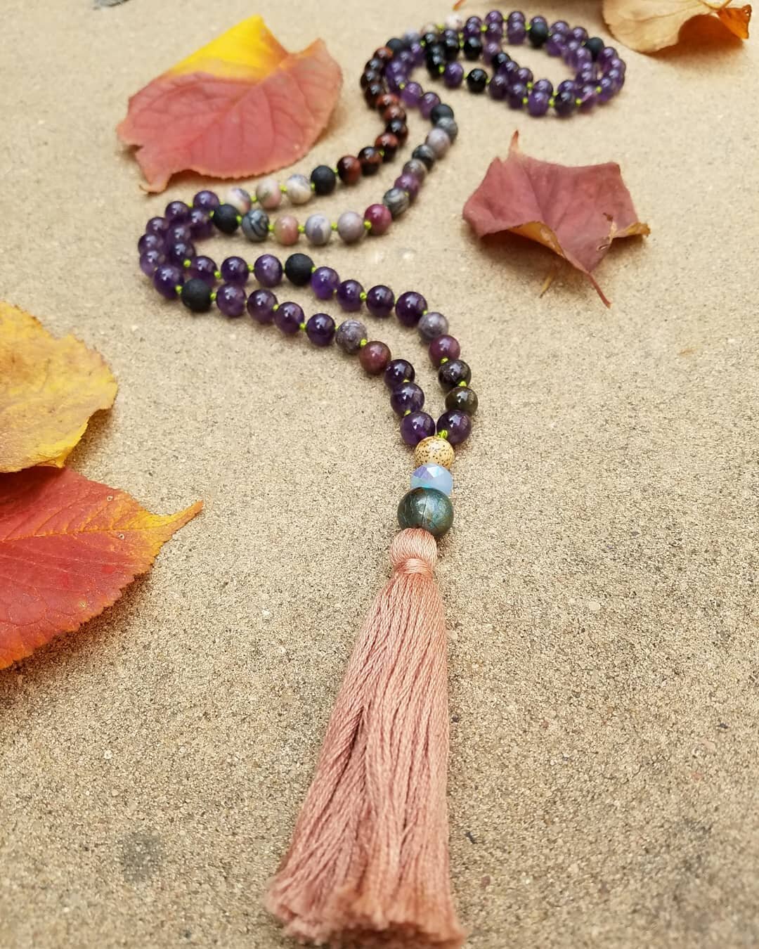 Fall is definitely in the air and the Intergalactic Moon mala couldn't be more perfect for the full Harvest moon coming this Thursday. Swoon!⁠
⁠
The Intergalactic Moon mala is a powerful blend of tourmaline, red tigers eye, lava, amethyst and ⁠mookai