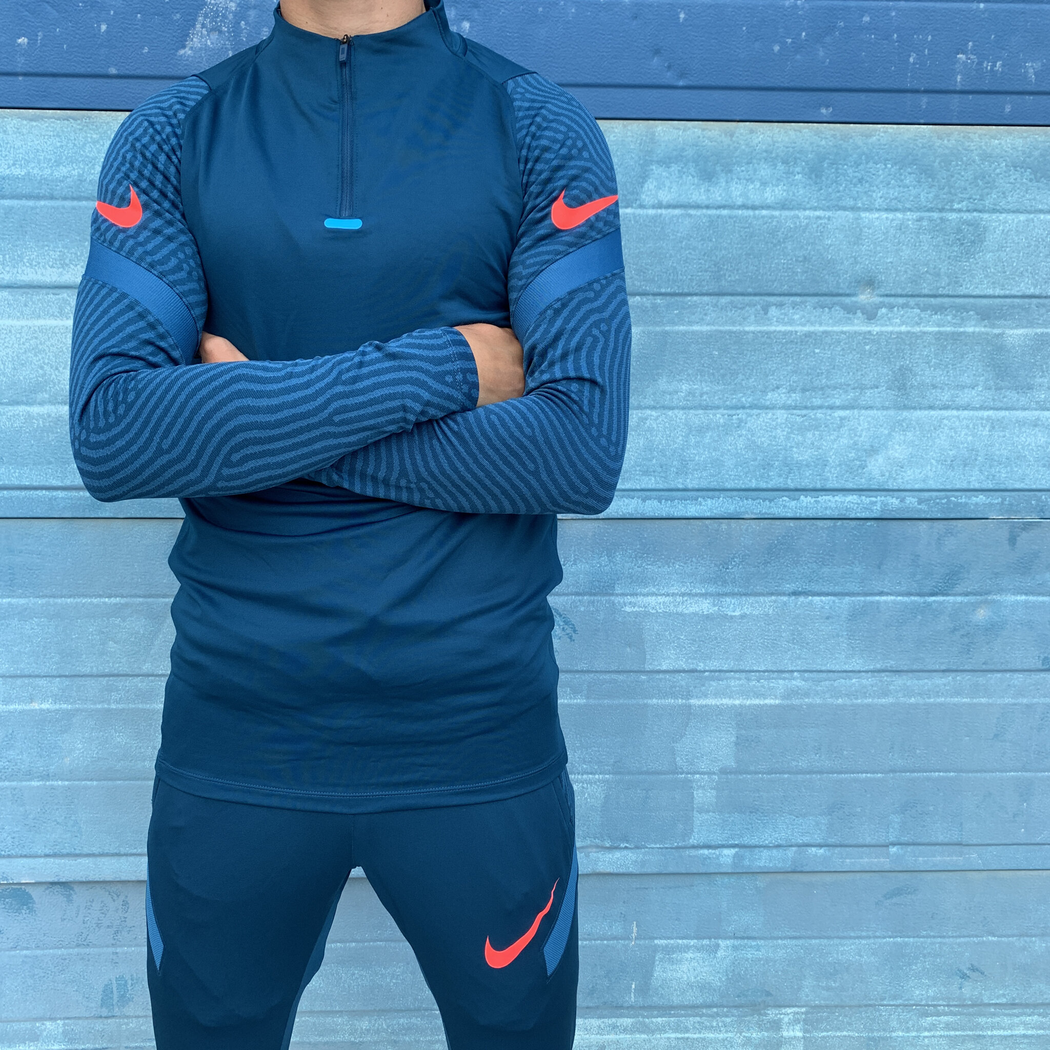 orange and blue nike tracksuit