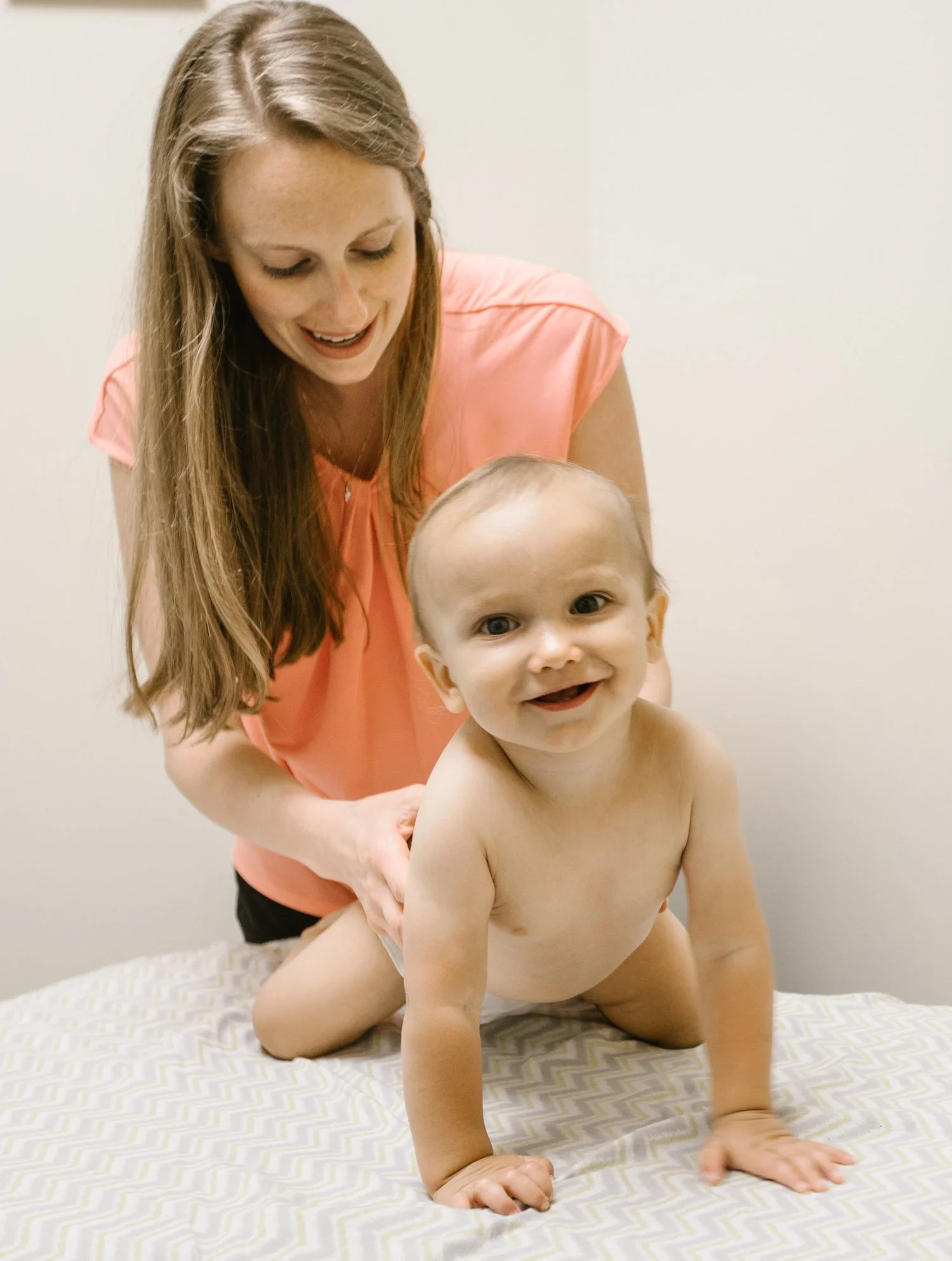 Dr. Holly adjusts spine of infant